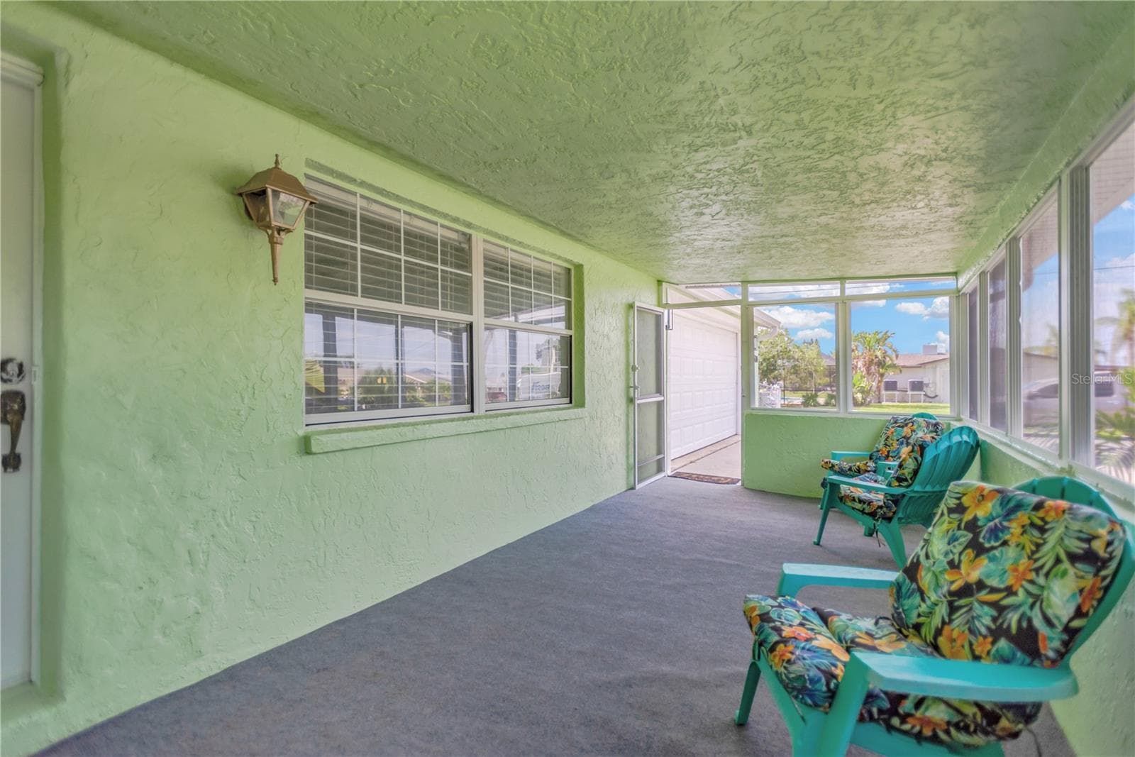 Enjoy relaxing on your spacious, enclosed front porch / Florida Room providing additional space for full year enjoyment. - 13724 COX AVE, HUDSON
