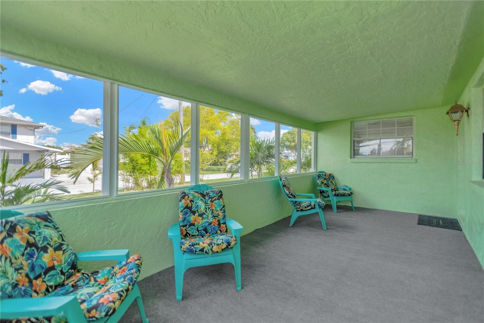 Another view of this spacious front porch/Florida Room which can accomodate fun furniture for the coastal lifestyle, casual environment. - 13724 COX AVE, HUDSON