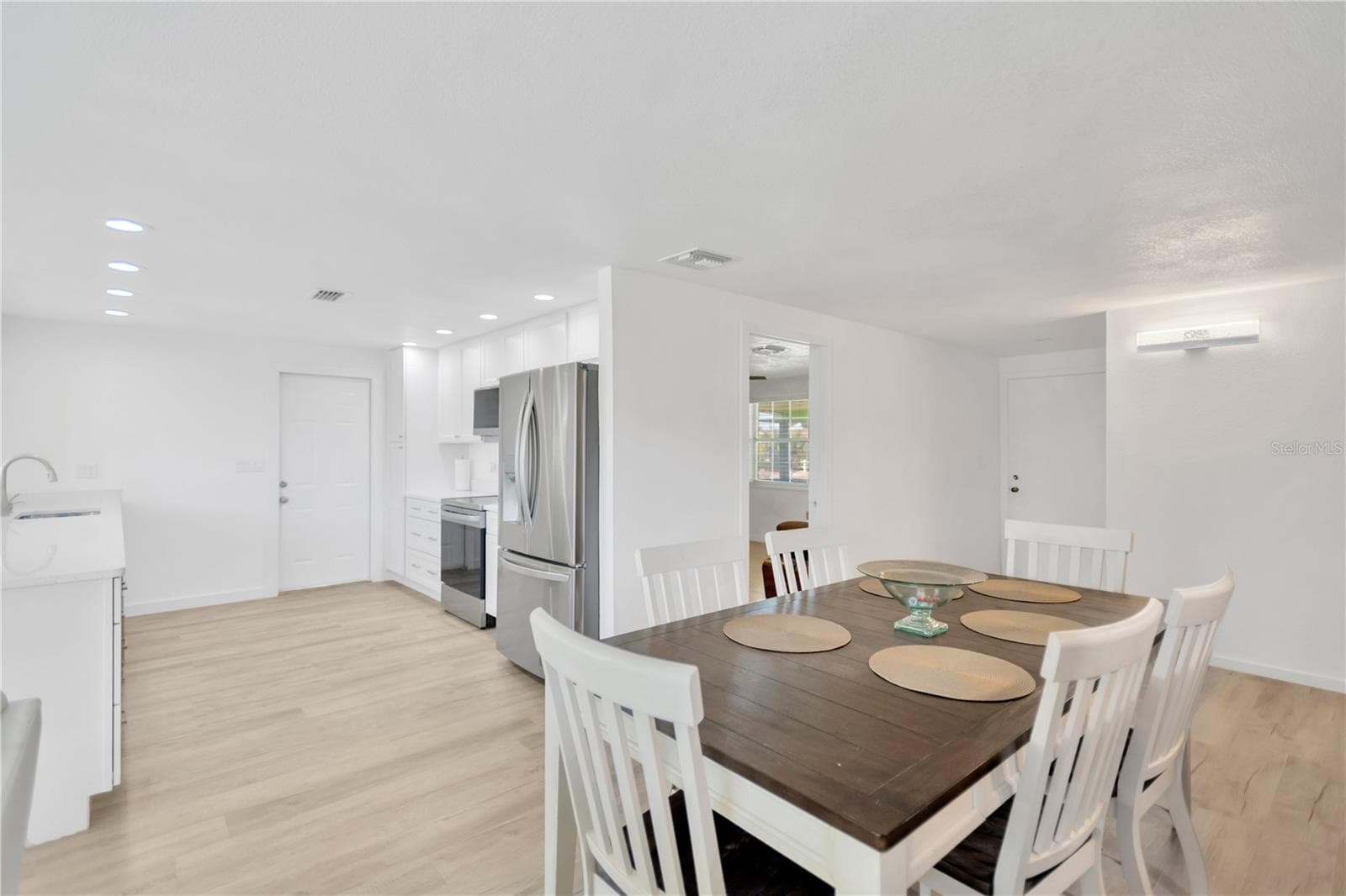 Light, bright sparkling dining area and beautifully appointed kitchen with clean, sleek lines will sure to delight. - 13724 COX AVE, HUDSON