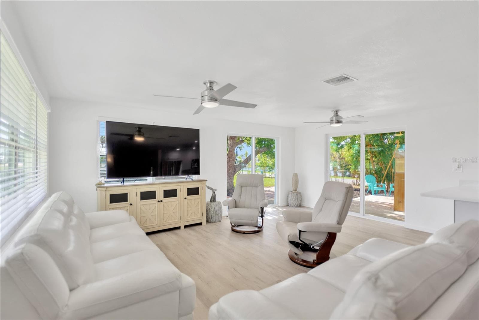 Relax and enjoy in this welcoming Living space with outdoor views from every window/door. - 13724 COX AVE, HUDSON
