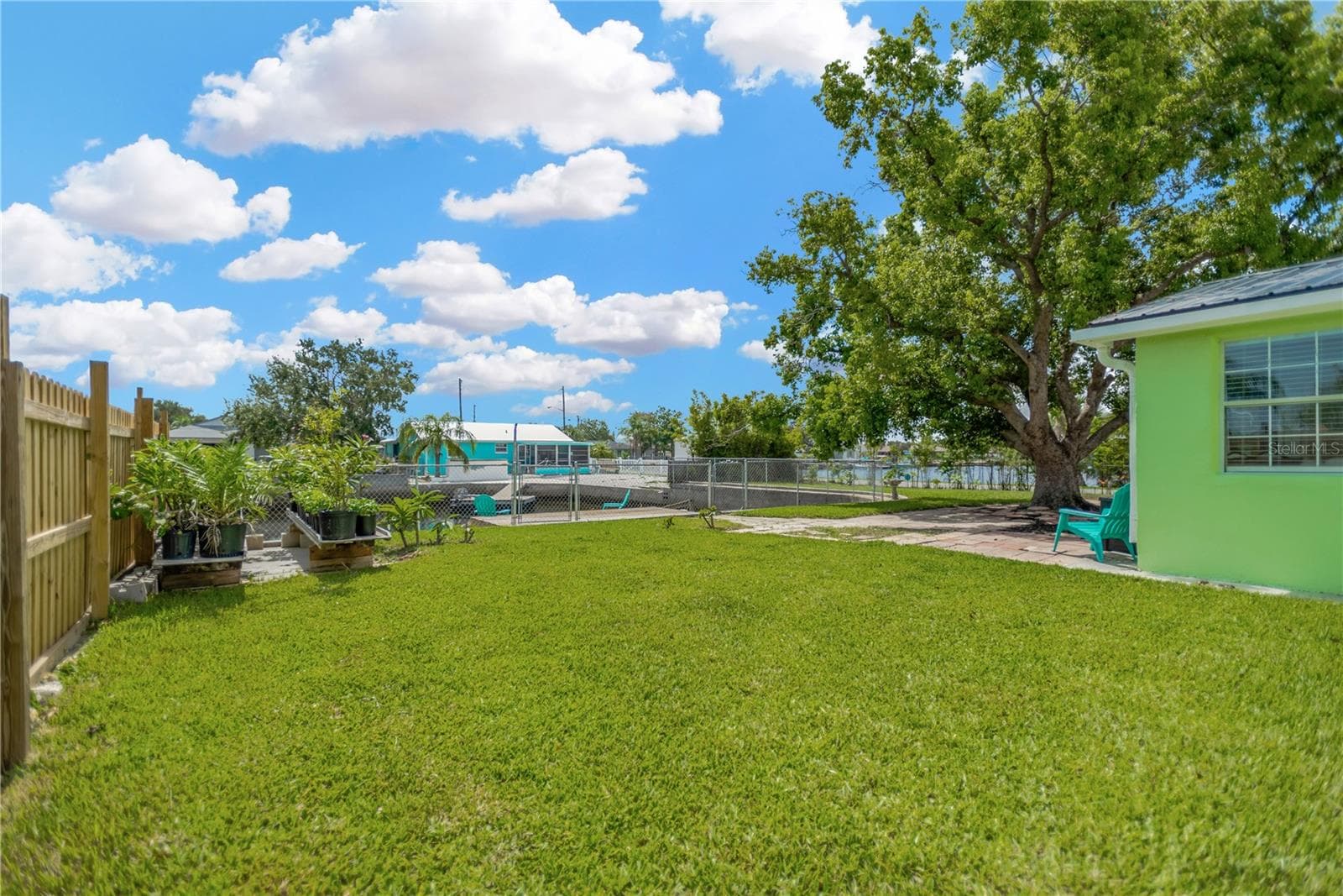 Side yard provides ample green space to enjoy a garden or store your water toys.  Property is fully fenced. - 13724 COX AVE, HUDSON