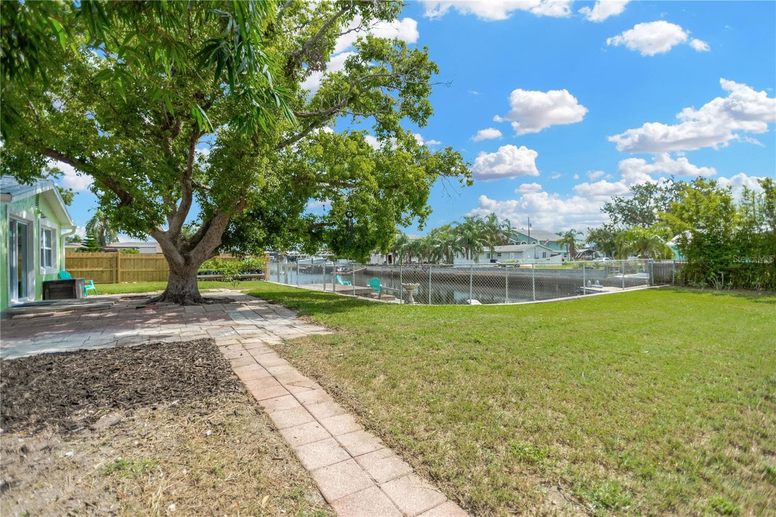 Majestic shade tree enhances this picturesque backyard. - 13724 COX AVE, HUDSON