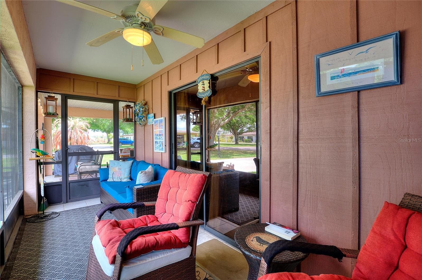Lanai with sliders leading into the living area - 302 GENESIS POINTE DR, LAKE WALES