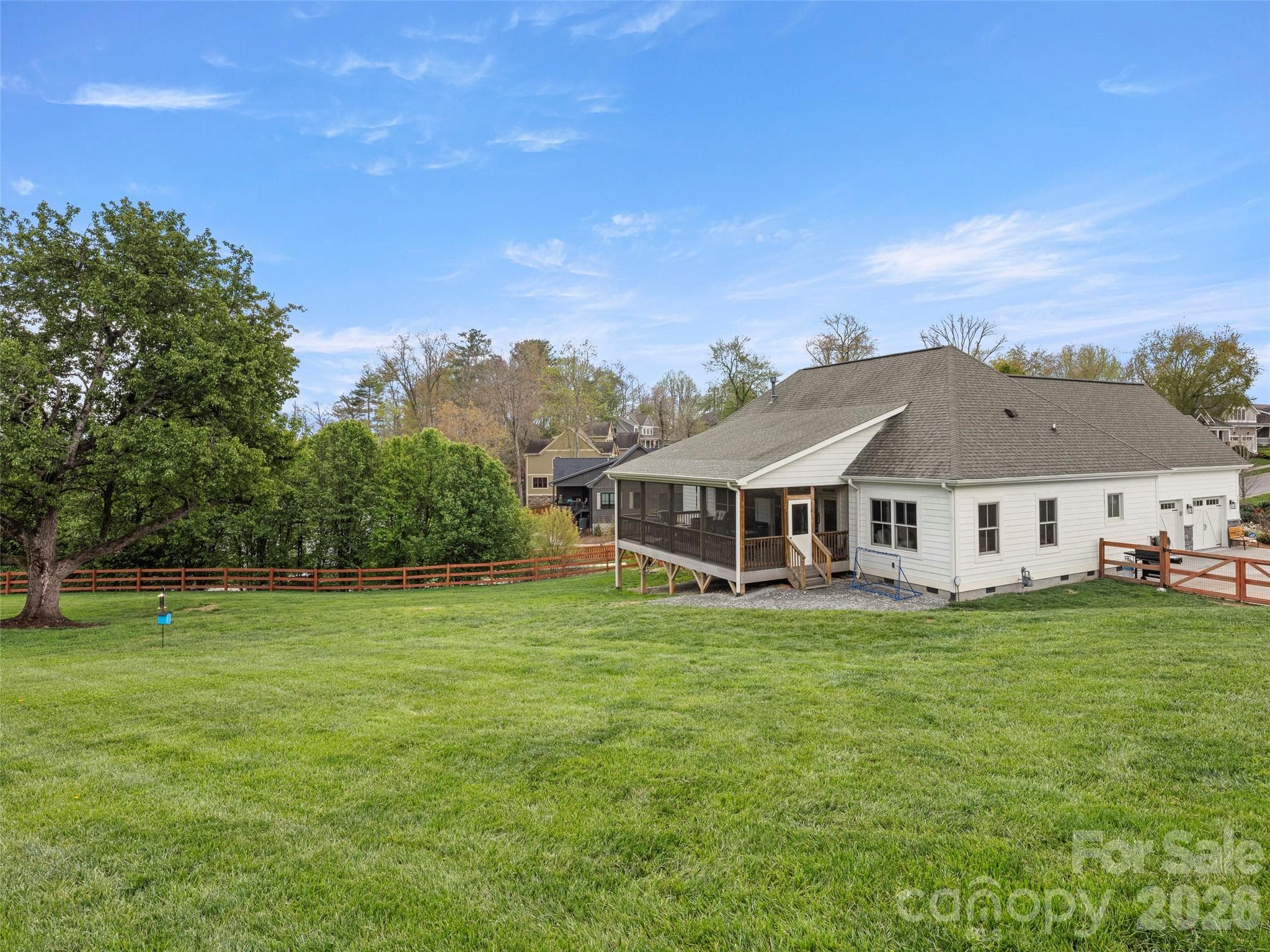 Extremely usable nearly-level backyard with freshly repaired and stained fencing that is HOA-approved - 127 Rockbridge Road, Mills River