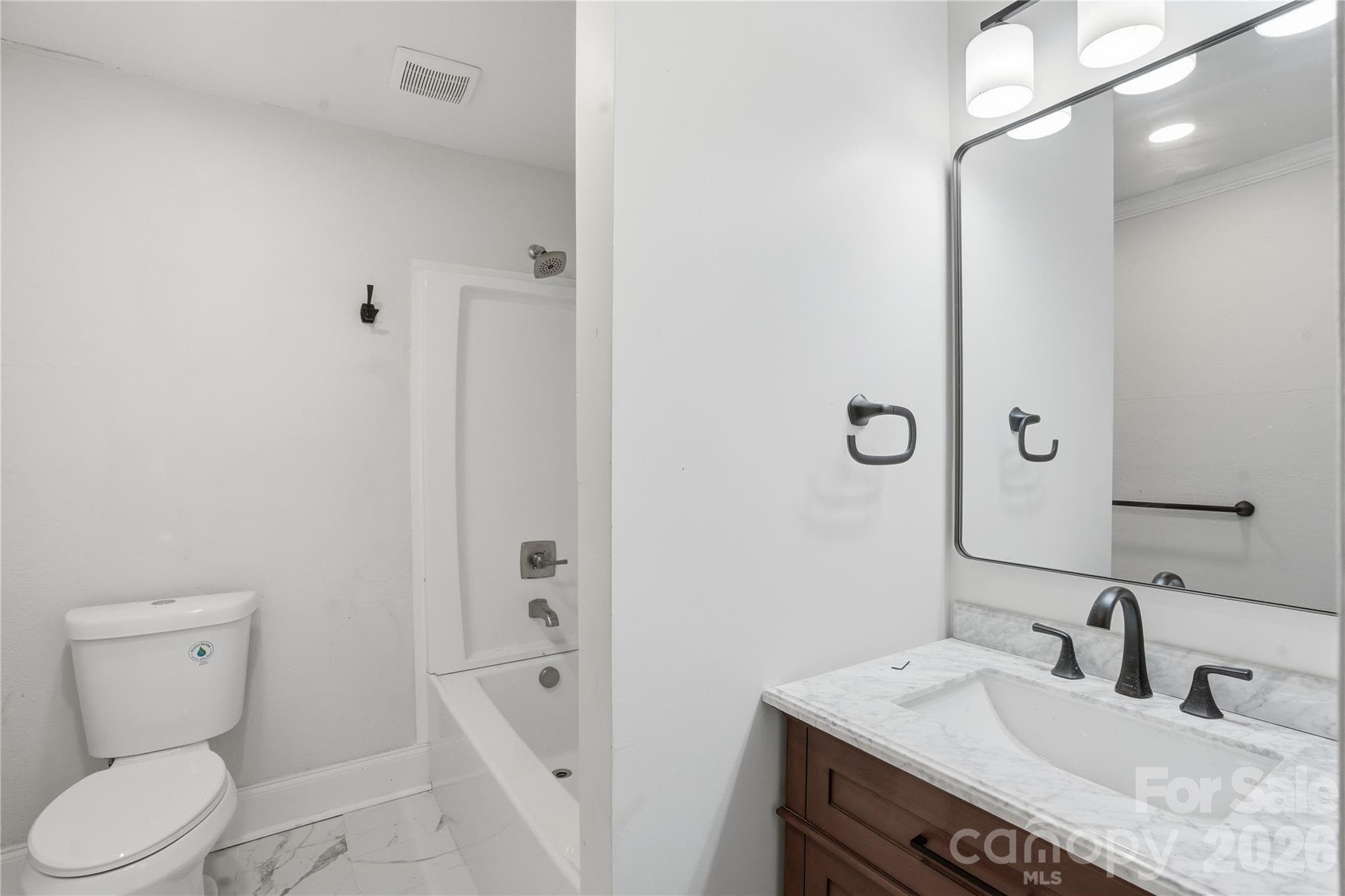 Updated bathroom with modern finishes - 234 S Ervin Avenue, Newton