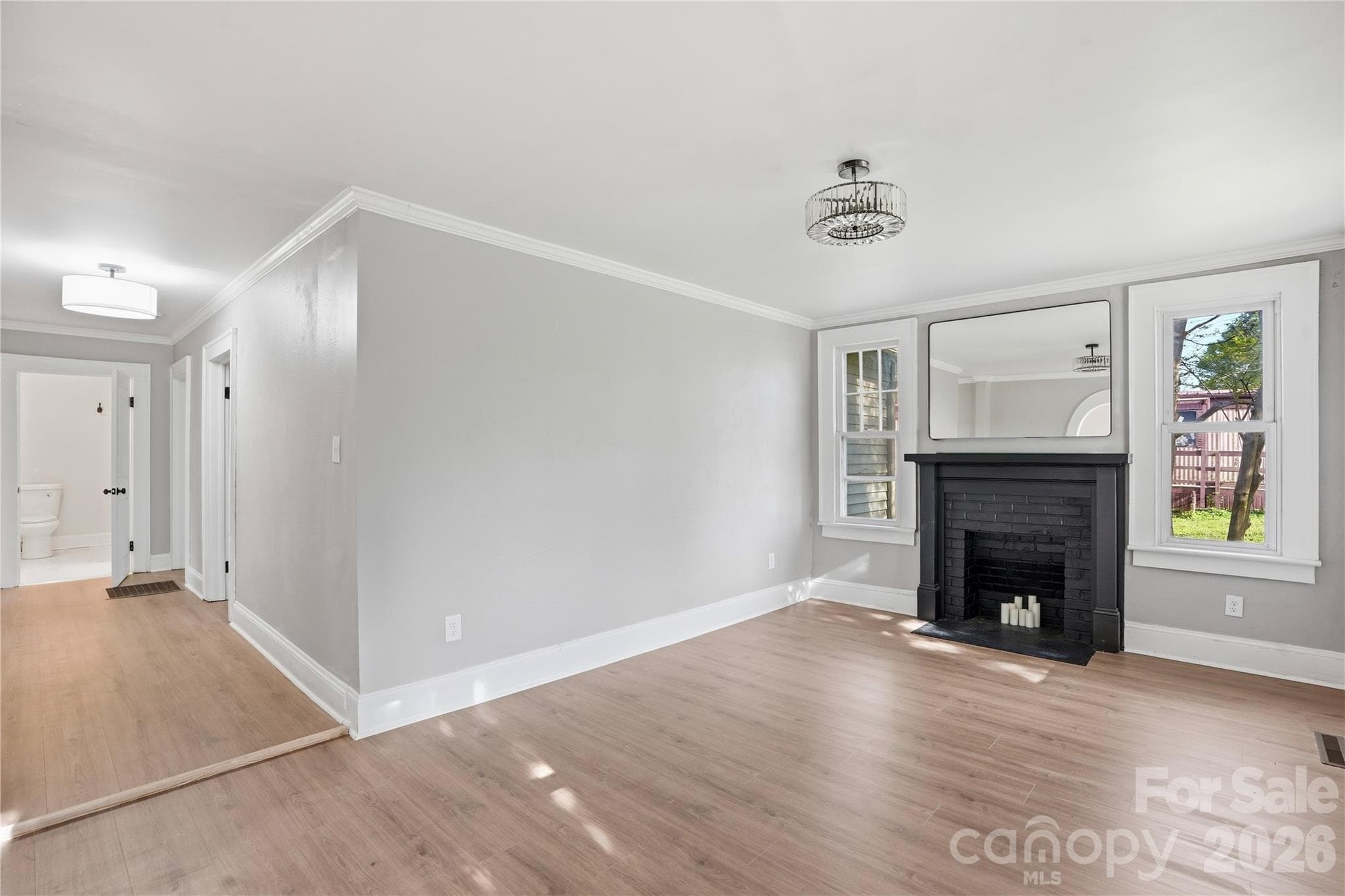Inviting living room centered around a charming fireplace - Newton