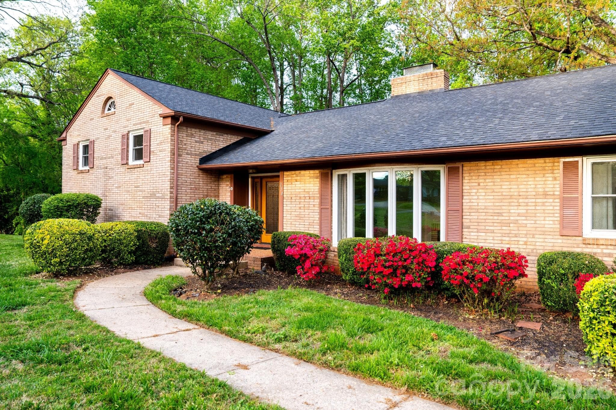 Sidewalk entrance with maintained landscaping - Statesville