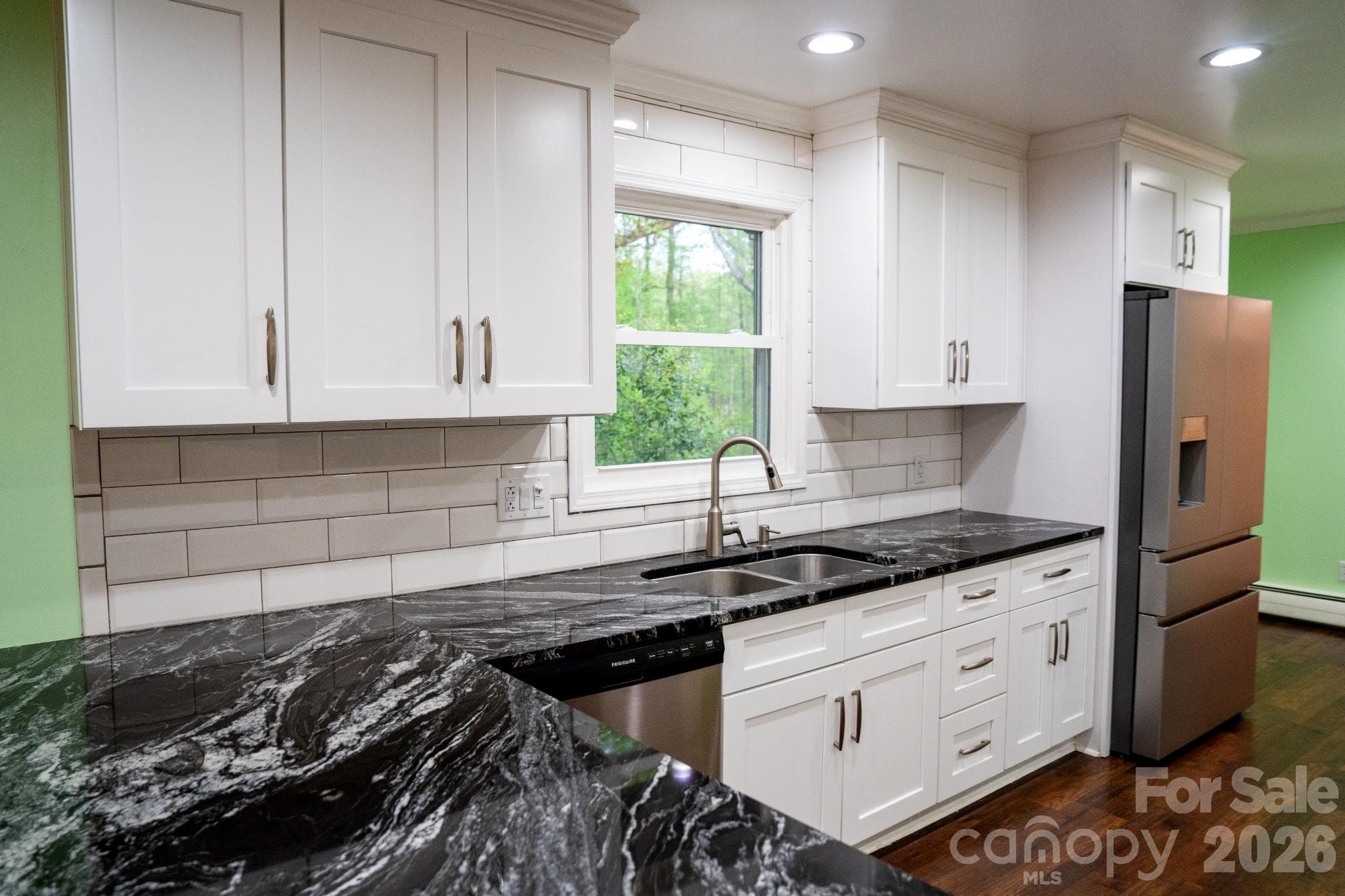Marble countertops with white tile backsplash - Statesville