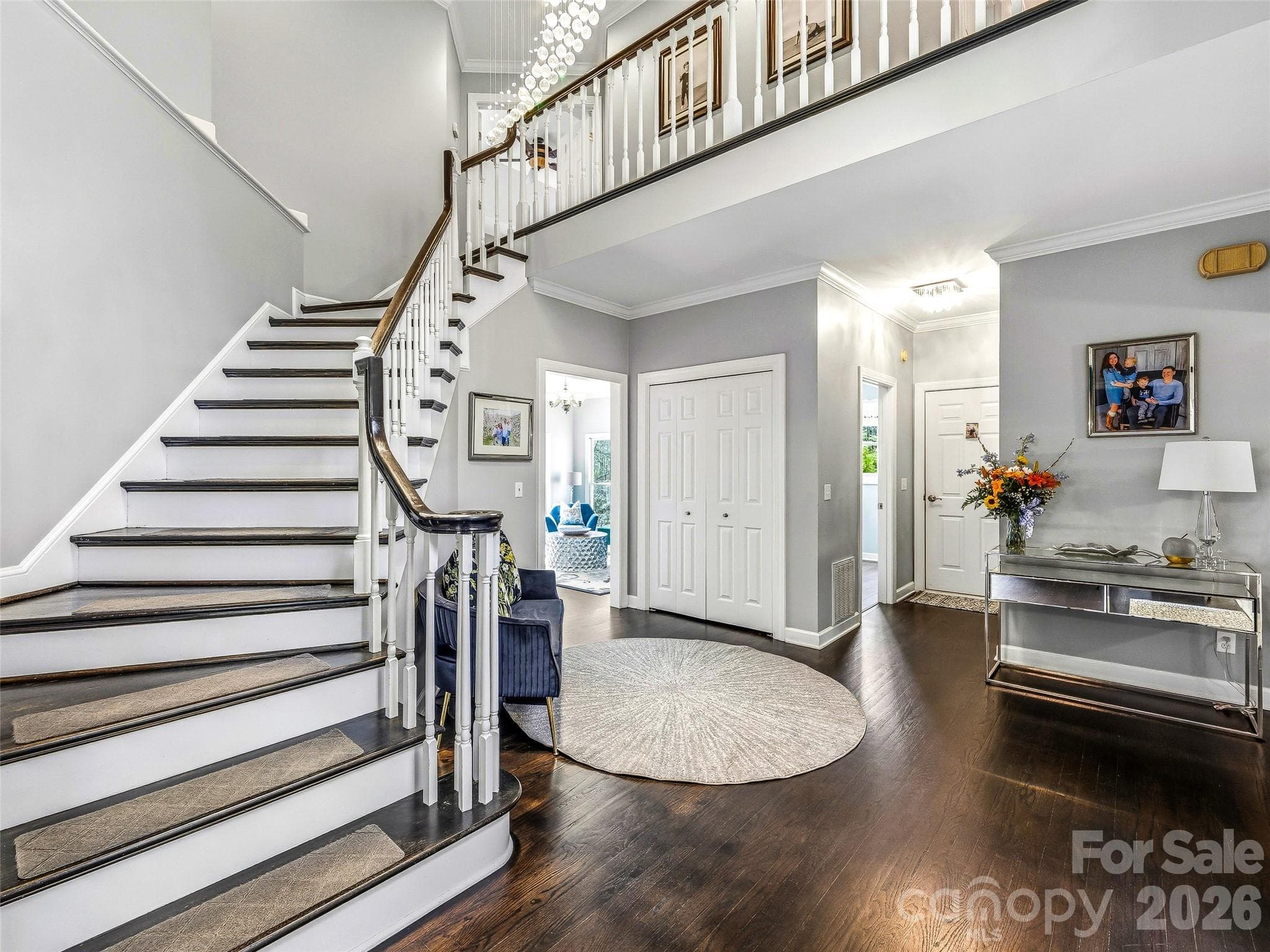 The foyer looking towards the family room, garage and laundry room. - Fletcher