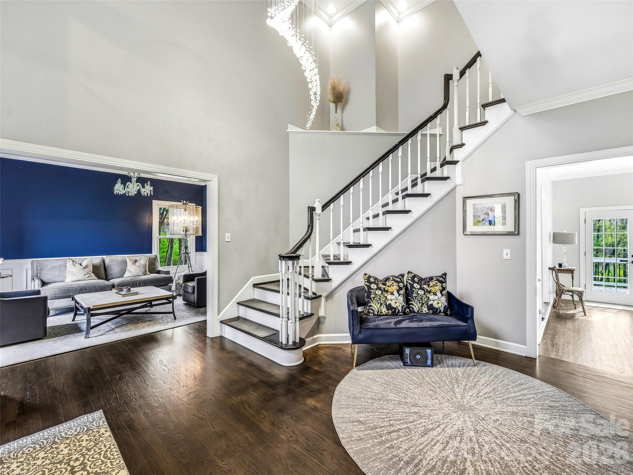 The foyer looking towards the formal dining room and the family room. - Fletcher