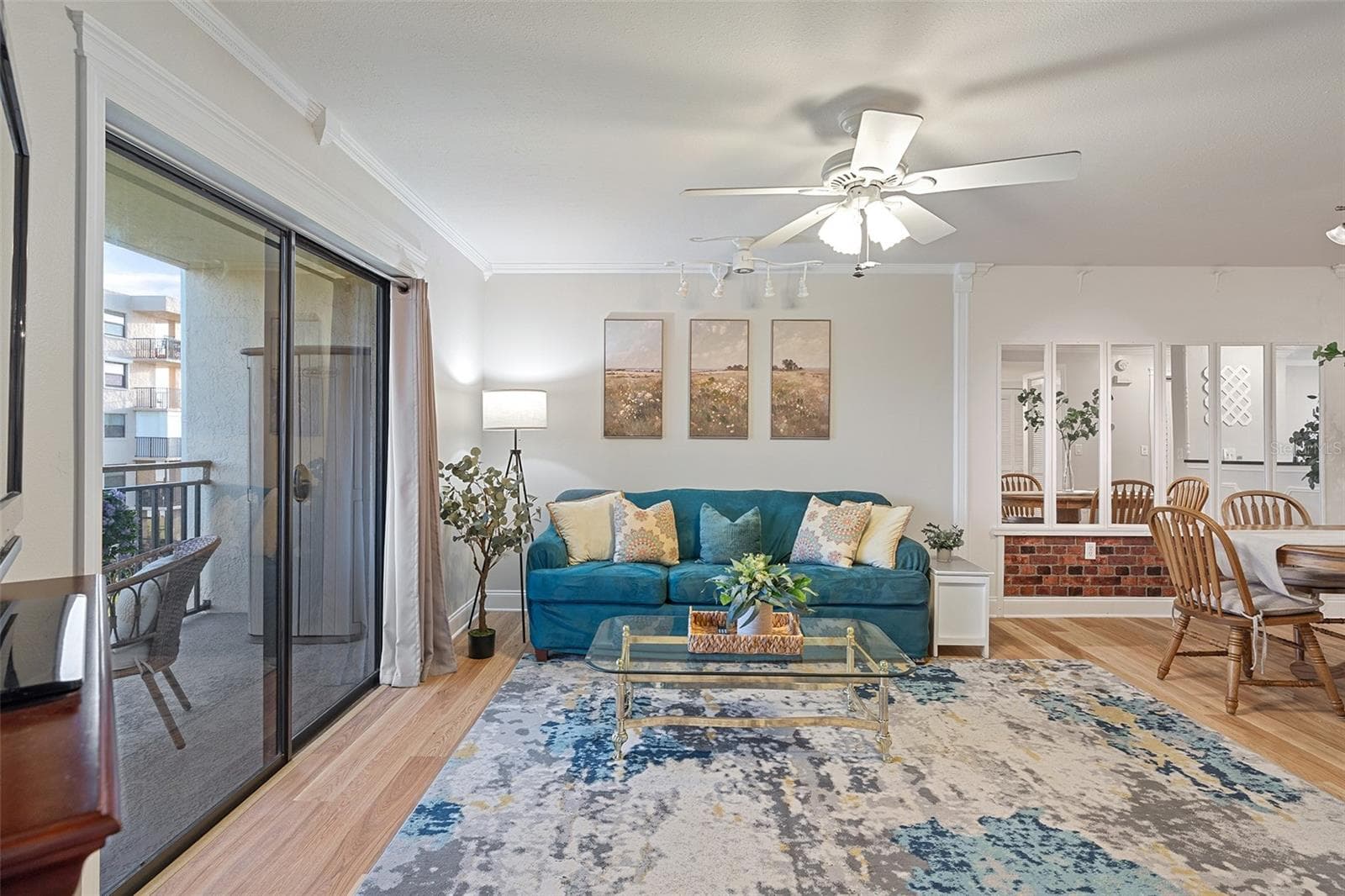 Living room with private balcony - 200 INTERNATIONAL DRIVE #815, CAPE CANAVERAL