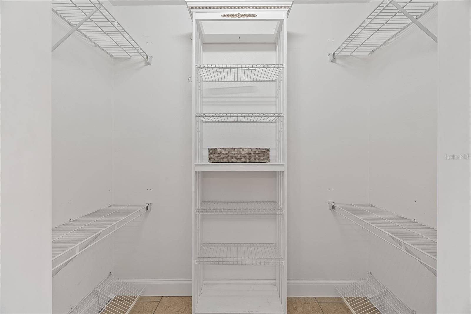 Primary bedroom walk in closet - 200 INTERNATIONAL DRIVE #815, CAPE CANAVERAL