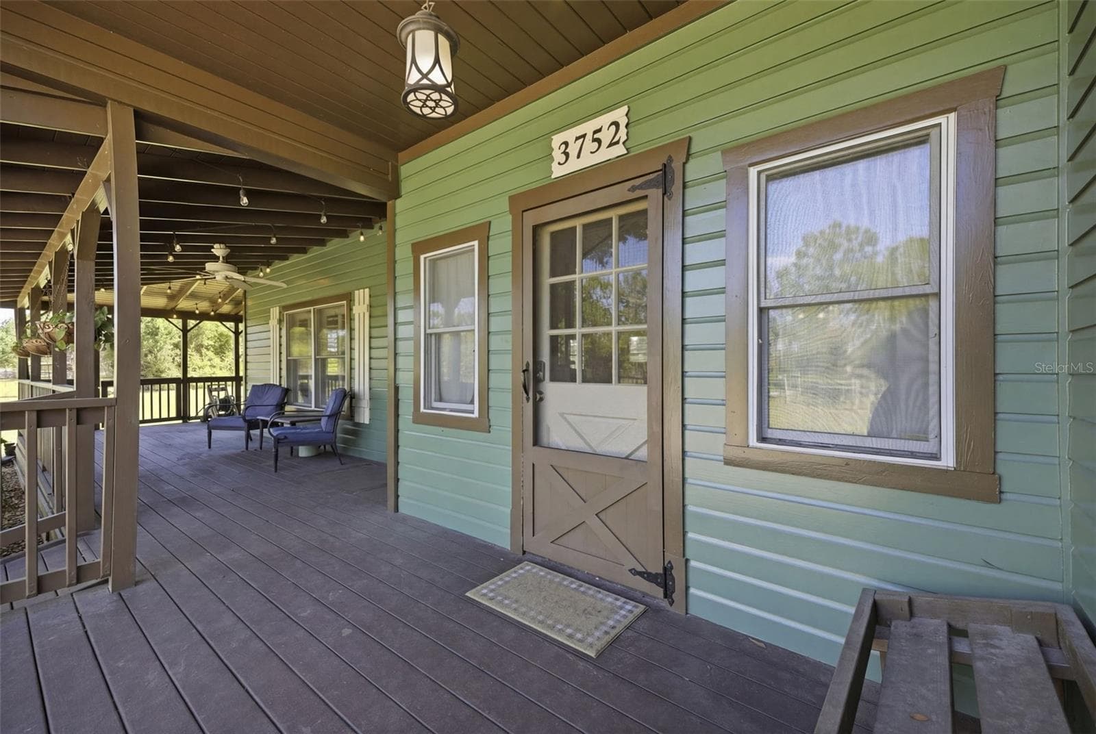 Front door and the 3/4 wrap around porch with - 3752 OLD KEYSTONE RD, TARPON SPRINGS