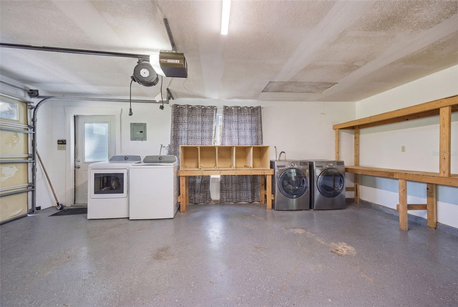 Double Laundry hookup and built in shelves in 3 car garage - 3752 OLD KEYSTONE RD, TARPON SPRINGS