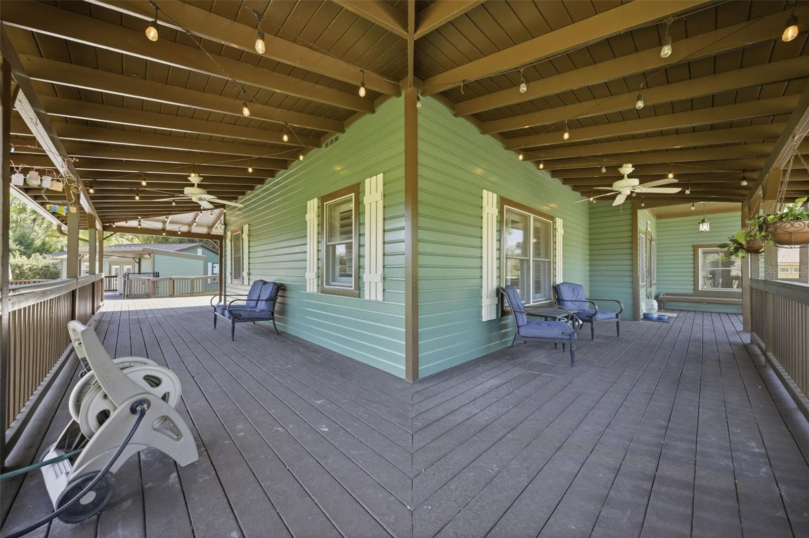North Corner view of wrap around porch - 3752 OLD KEYSTONE RD, TARPON SPRINGS
