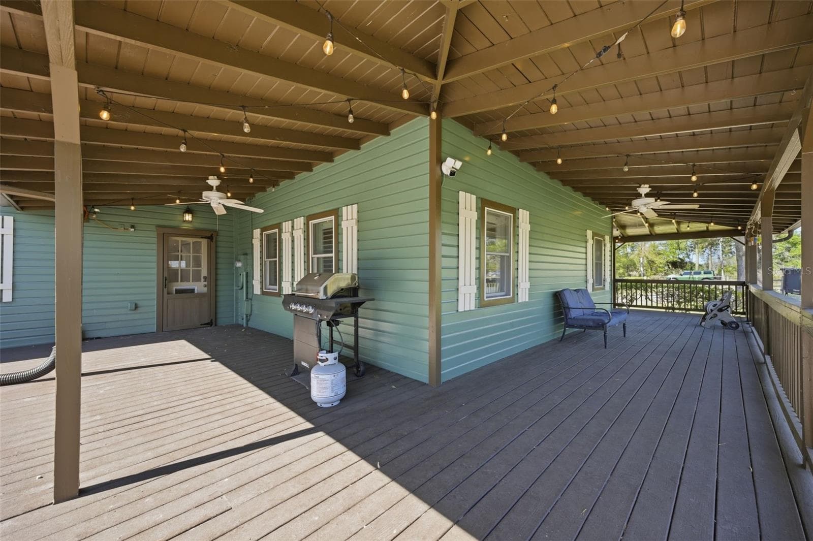 South Corner view of wrap around porch - 3752 OLD KEYSTONE RD, TARPON SPRINGS