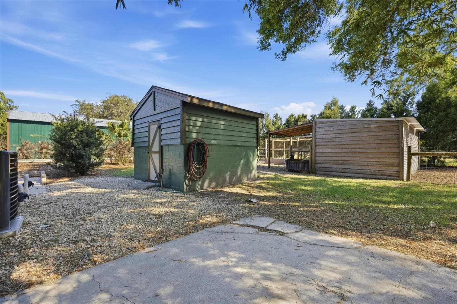 Feed barn with 2 stall barn in rear - 3752 OLD KEYSTONE RD, TARPON SPRINGS