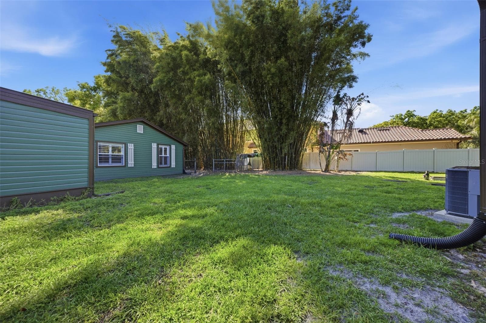 View of covered Hot tub area and side of In-Law Suite - 3752 OLD KEYSTONE RD, TARPON SPRINGS