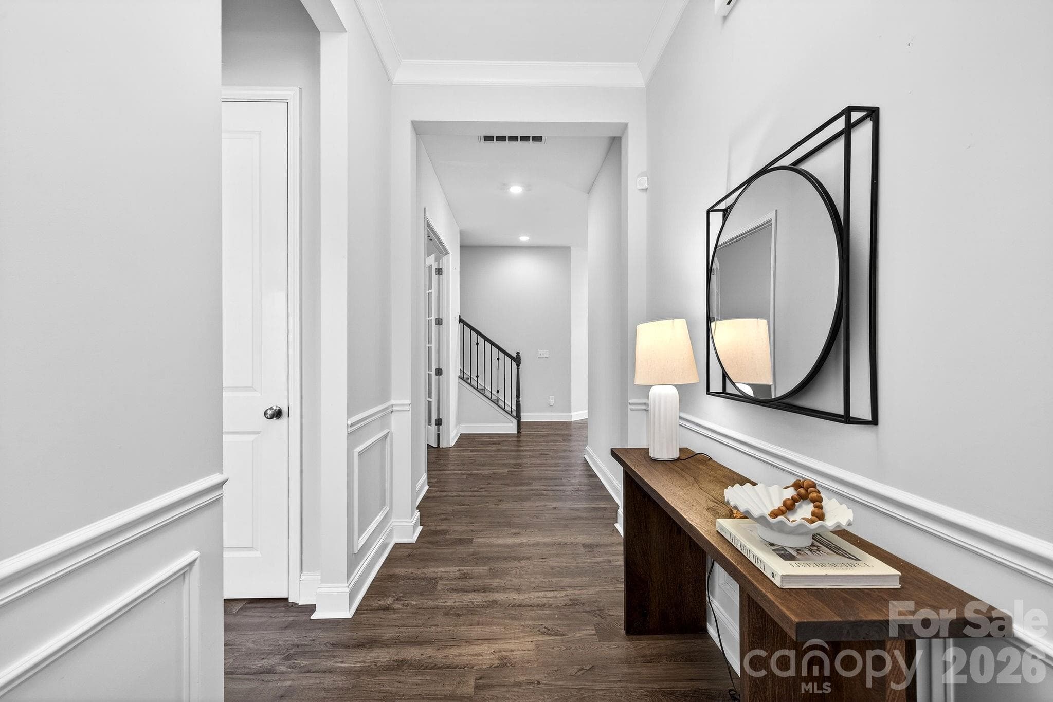 Warm wide-plank floors welcome you into the foyer - Charlotte