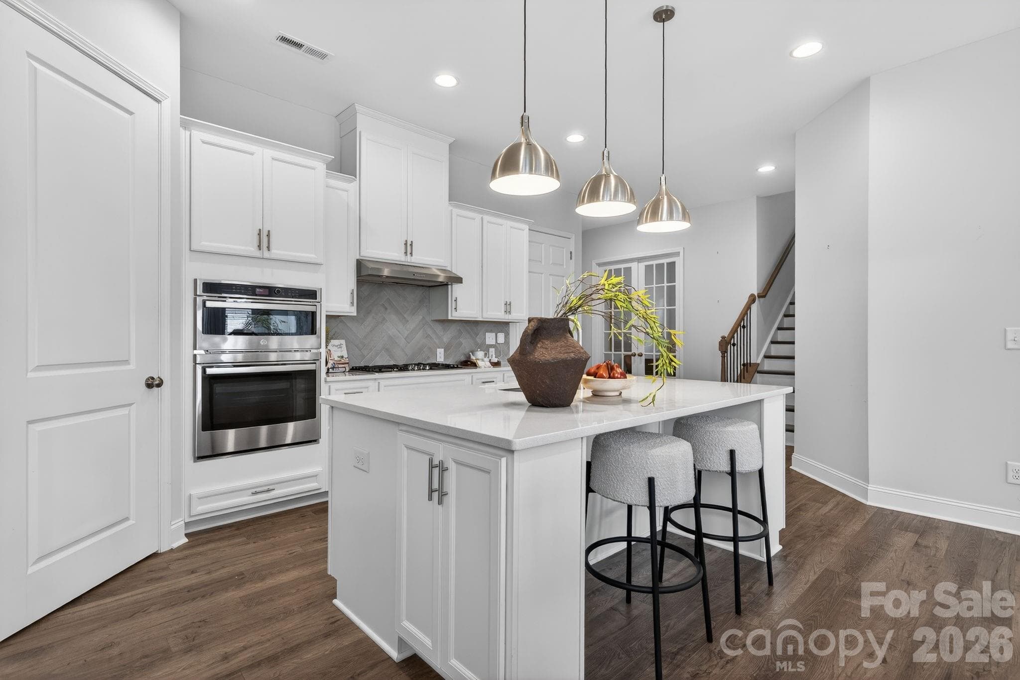 Modern pendant lighting illuminates counter seating - Charlotte