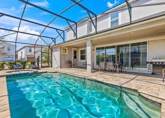 Screened in pool - 9042 SUNSHINE RIDGE LOOP, KISSIMMEE