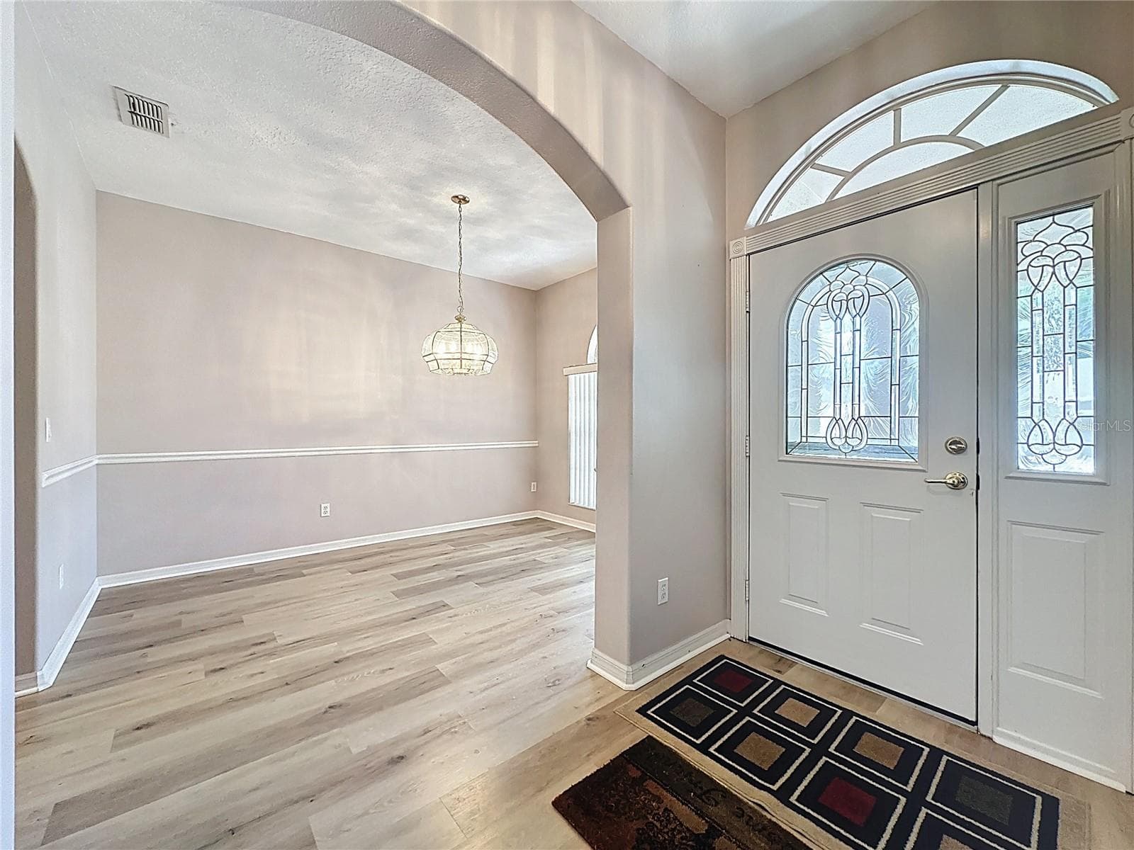 Foyer & view into dining room - 2308 TWICKINGHAM CT, CLERMONT