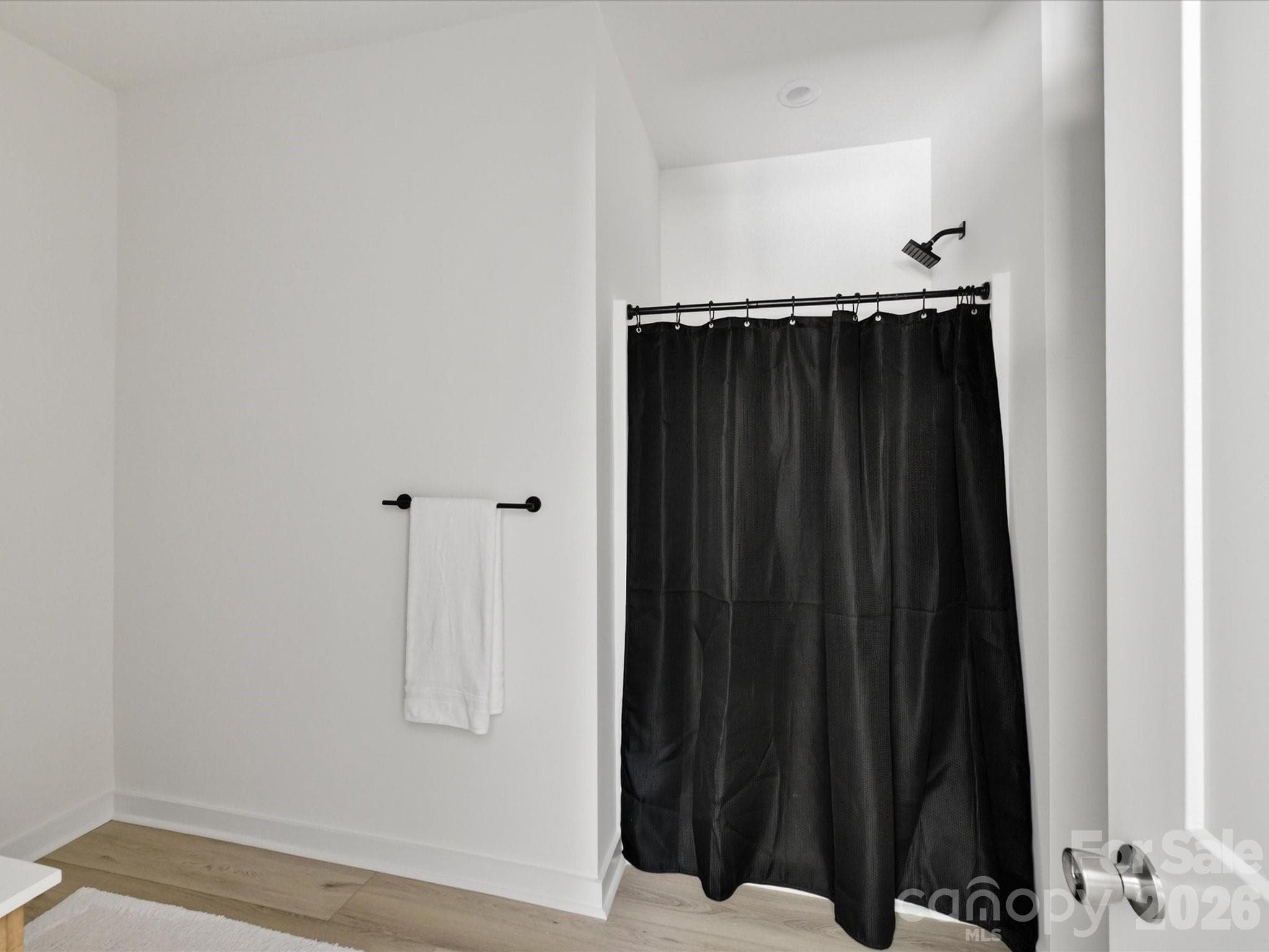 Primary bath shower with modern fixtures and a clean, minimalist design offering a relaxing retreat. - 655 Stillgreen Lane, Charlotte