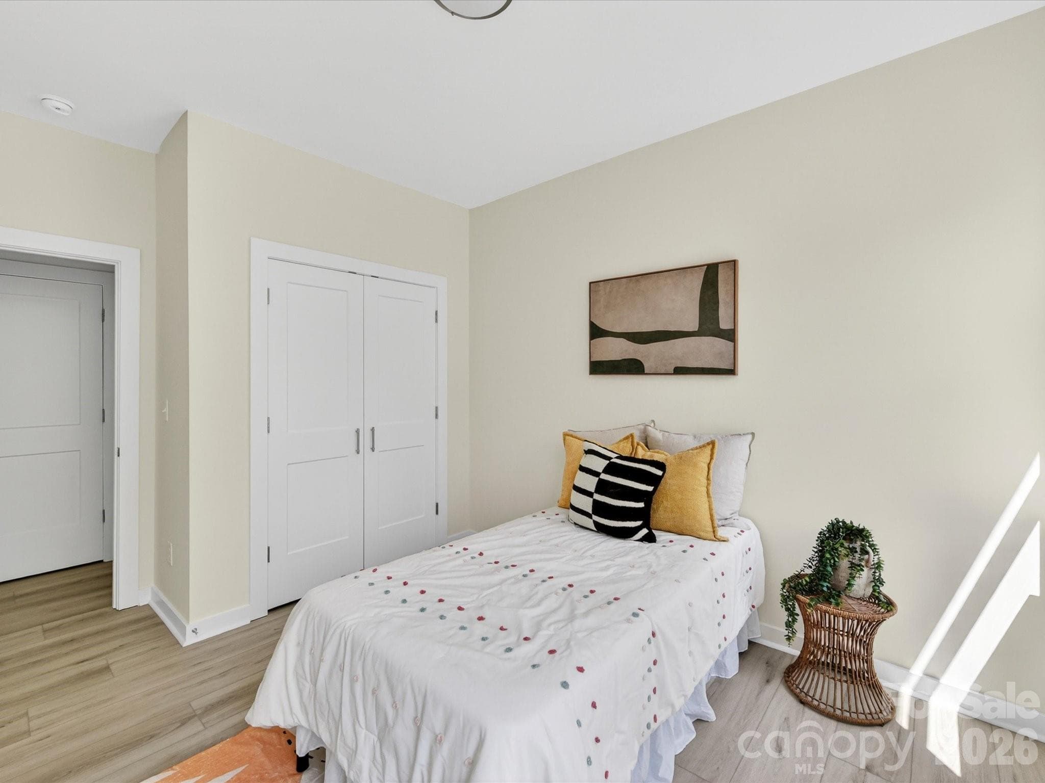 Cozy secondary bedroom filled with natural light, featuring neutral tones and a flexible layout ideal for guests, a home office, or additional living space. - 655 Stillgreen Lane, Charlotte