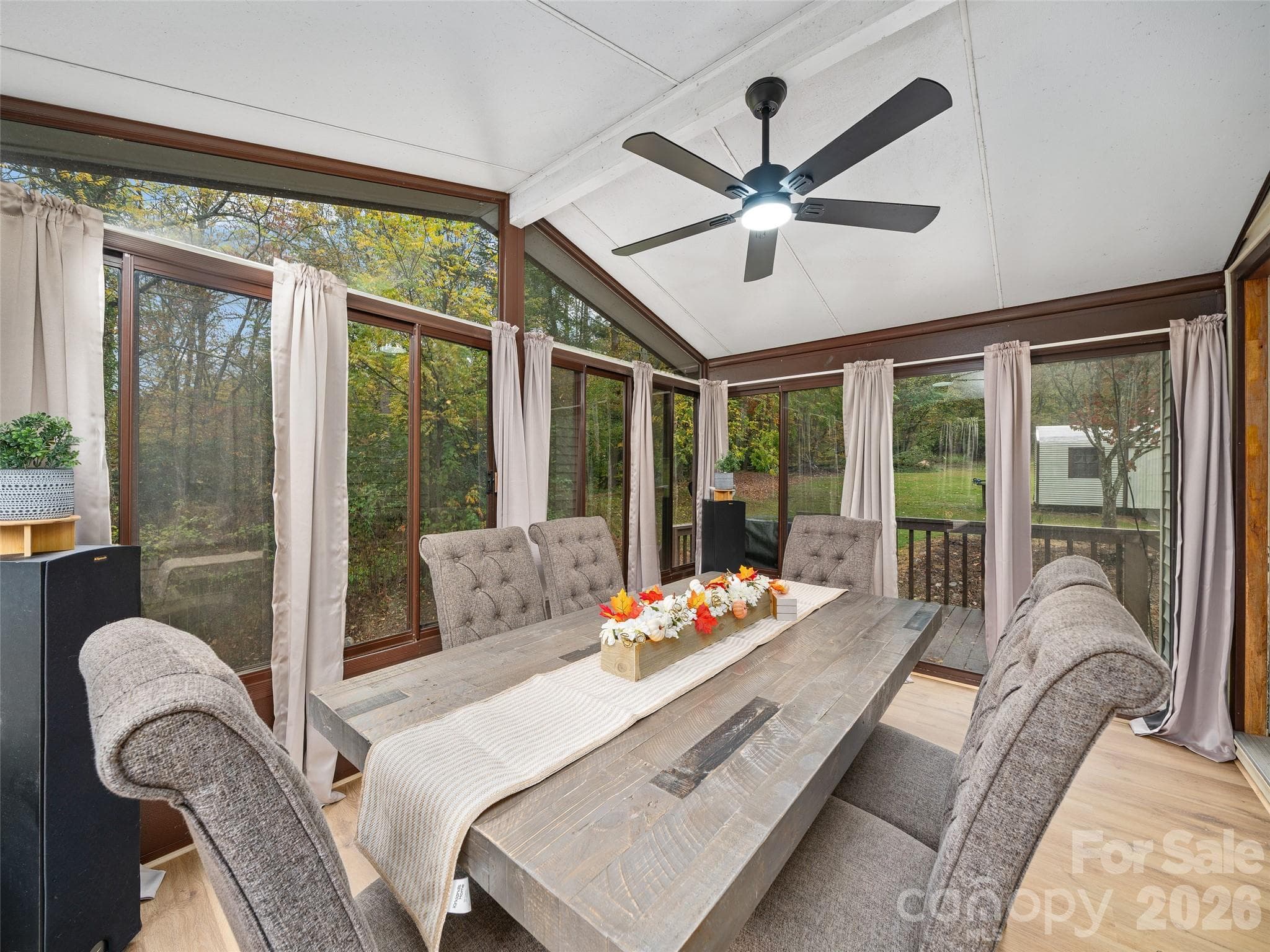 Relax and listen to the creek in the sunroom. - 1030 Hughes Gap Road, Bakersville