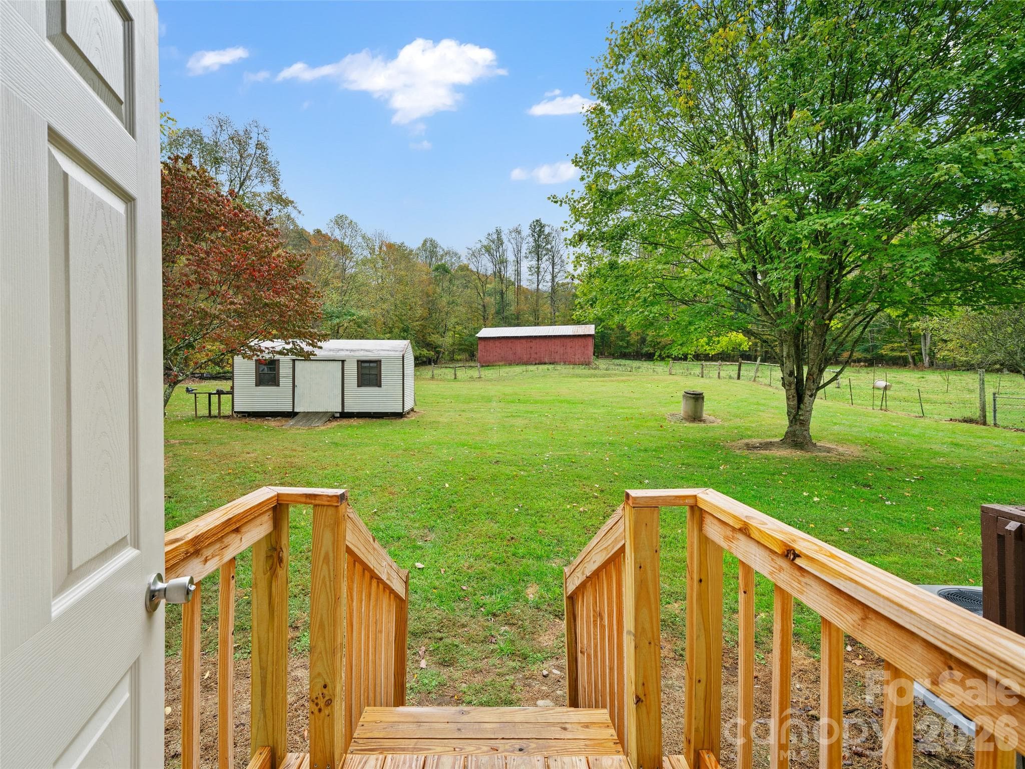 Great backyard. Perfect for gardening and homesteading. Large storage shed with a retro look! - 1030 Hughes Gap Road, Bakersville
