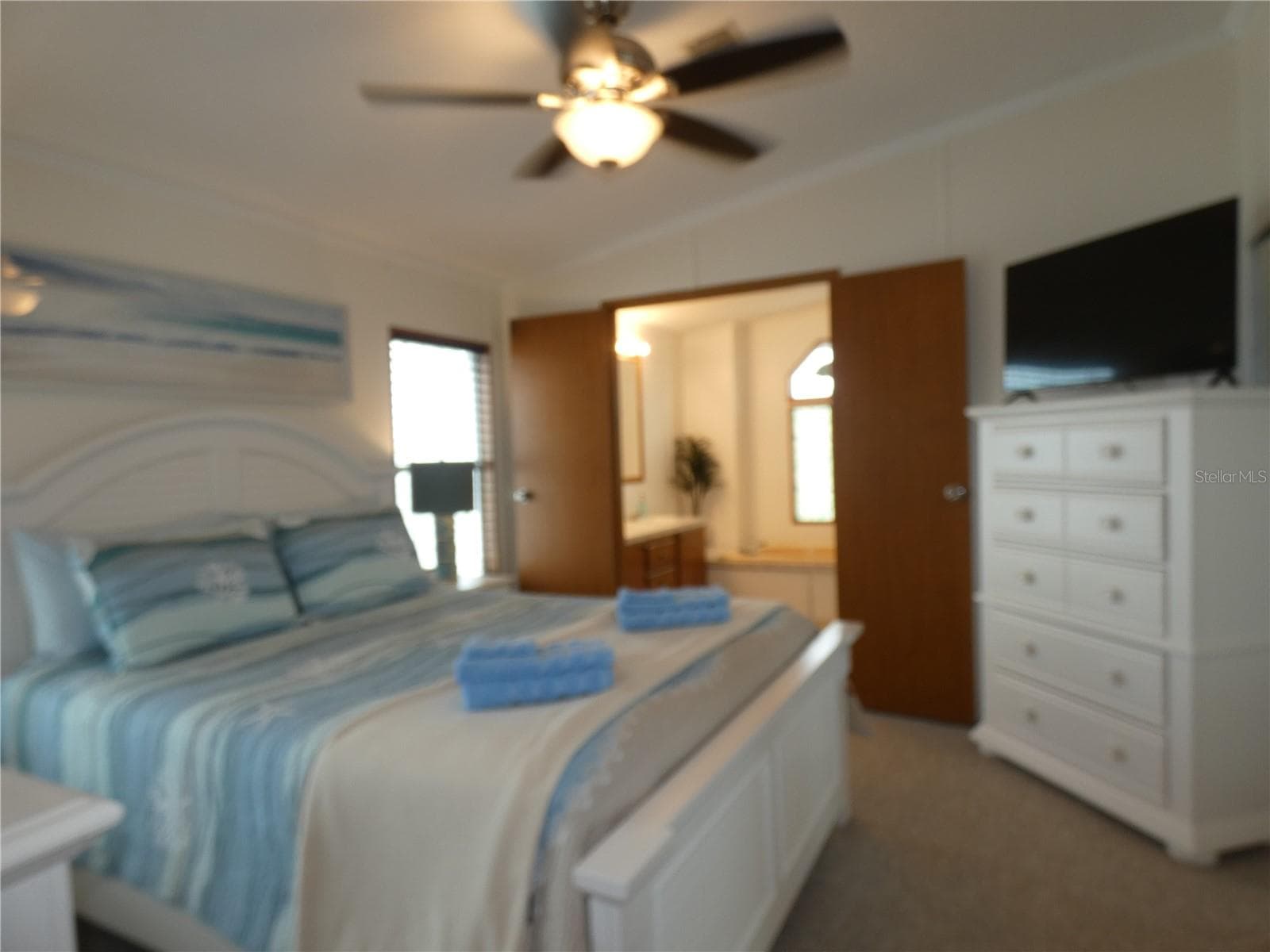 Primary bedroom with primary bathroom. - 6814 GULL LN, HUDSON