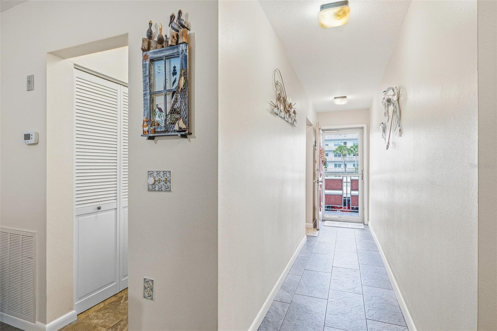 Hallway leading to main living areas - 5521 80TH ST N #212, ST PETERSBURG