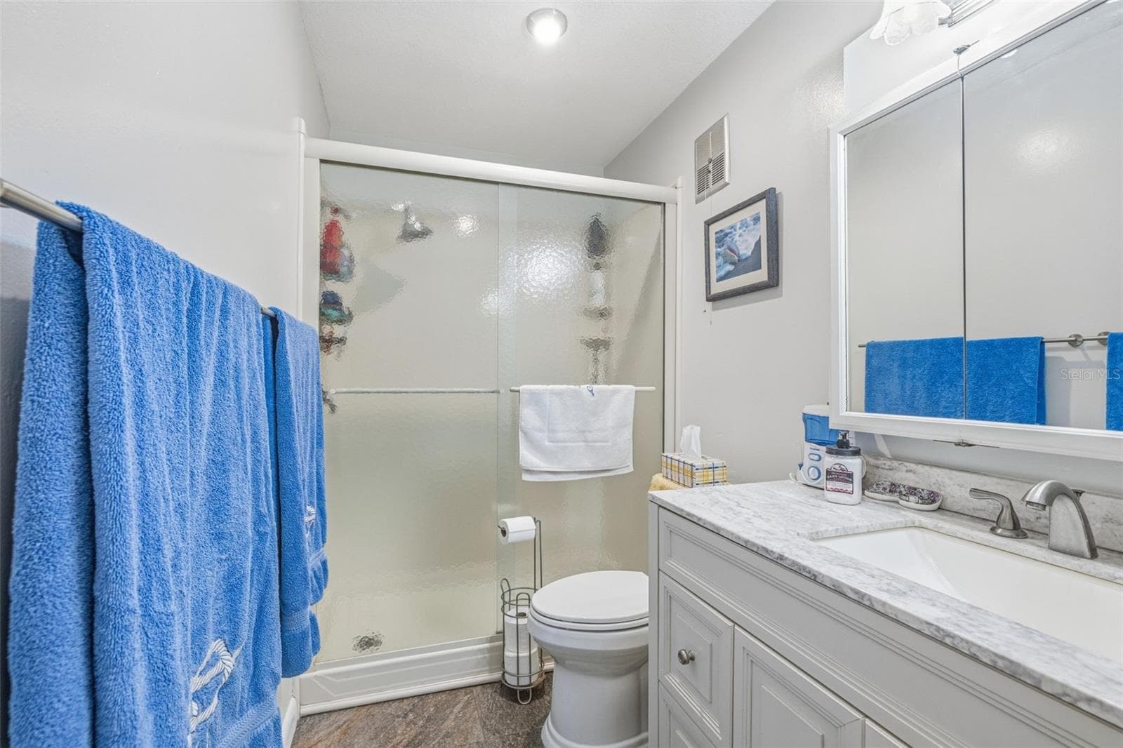 Full bathroom with walk in shower - 5521 80TH ST N #212, ST PETERSBURG