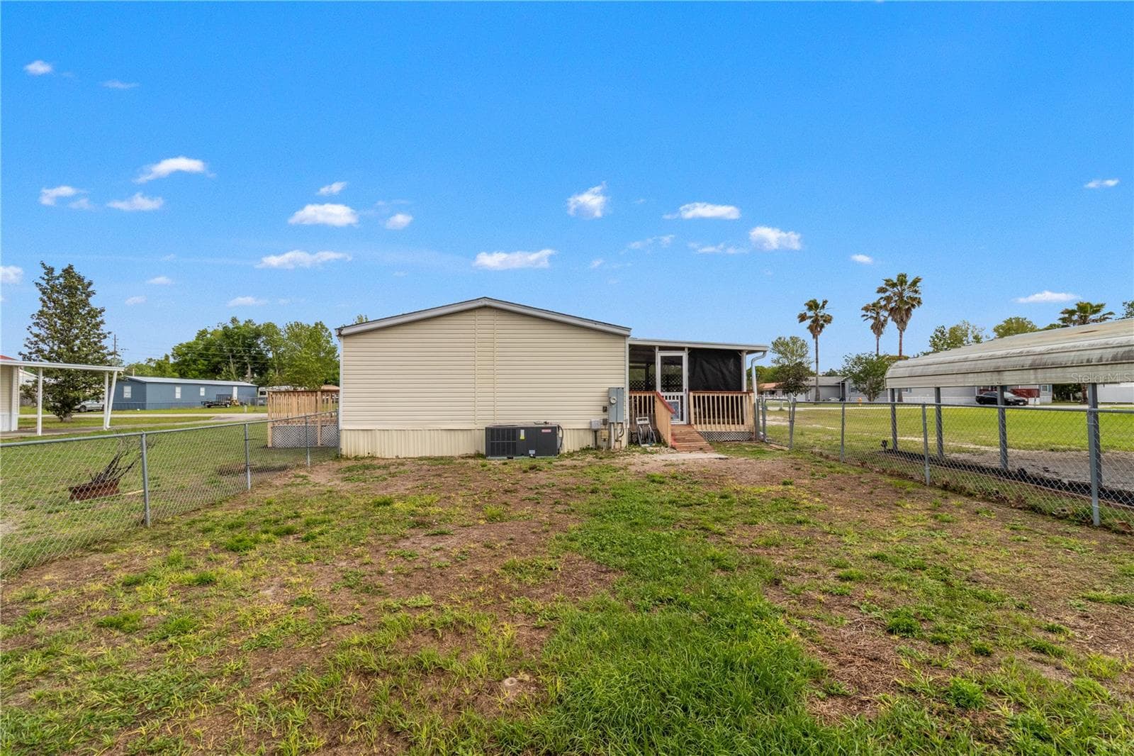 view of back oh home - 1371 NW 12TH LN, LAKE PANASOFFKEE