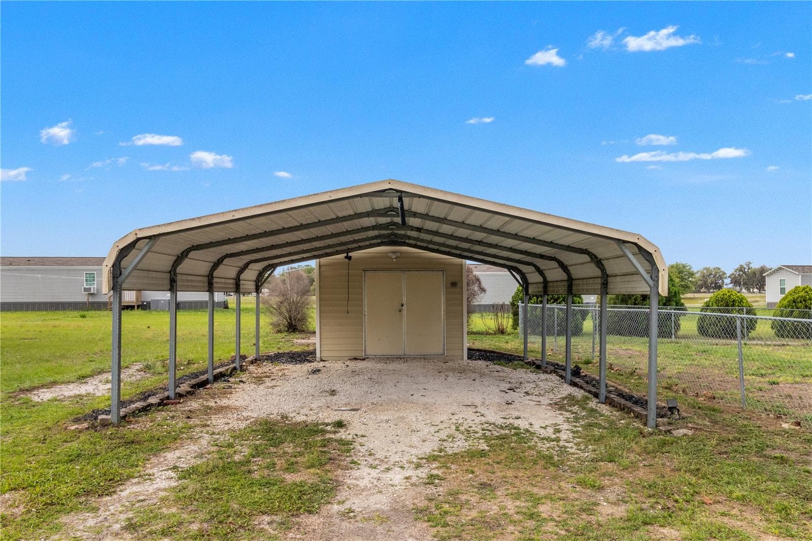 carport with storage shed - 1371 NW 12TH LN, LAKE PANASOFFKEE