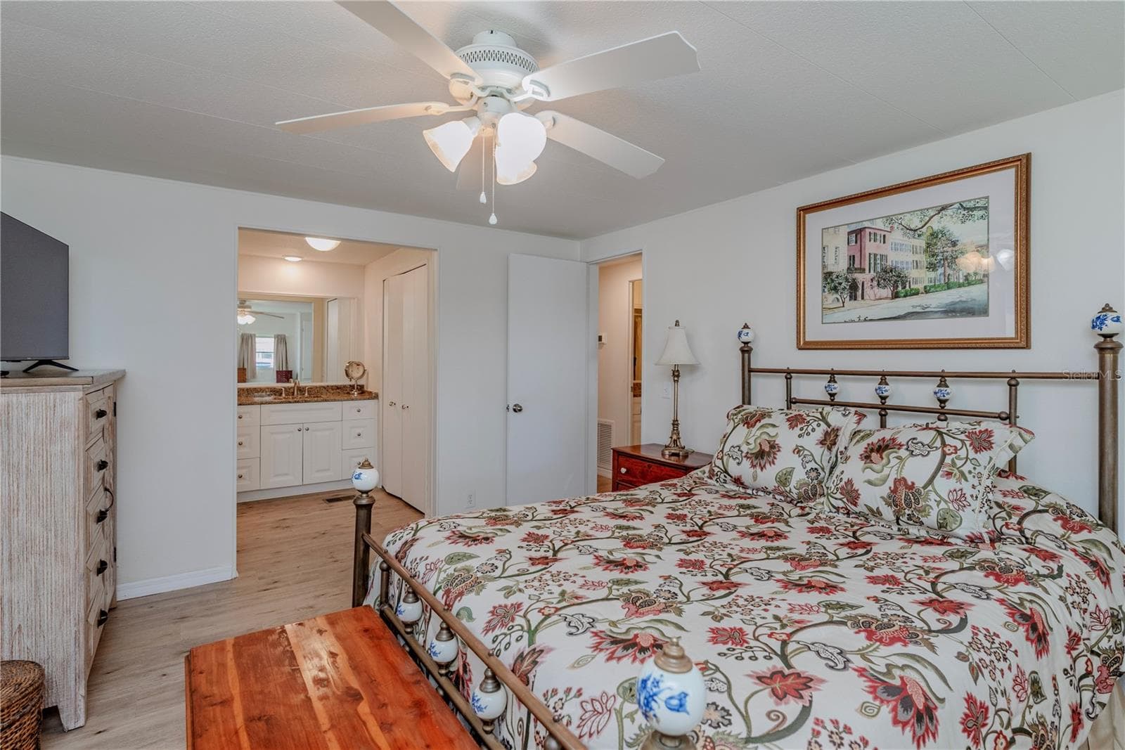 Primary bedroom with ensuite bath and walk-in closet. - 4851 W GANDY BLVD #23C, TAMPA