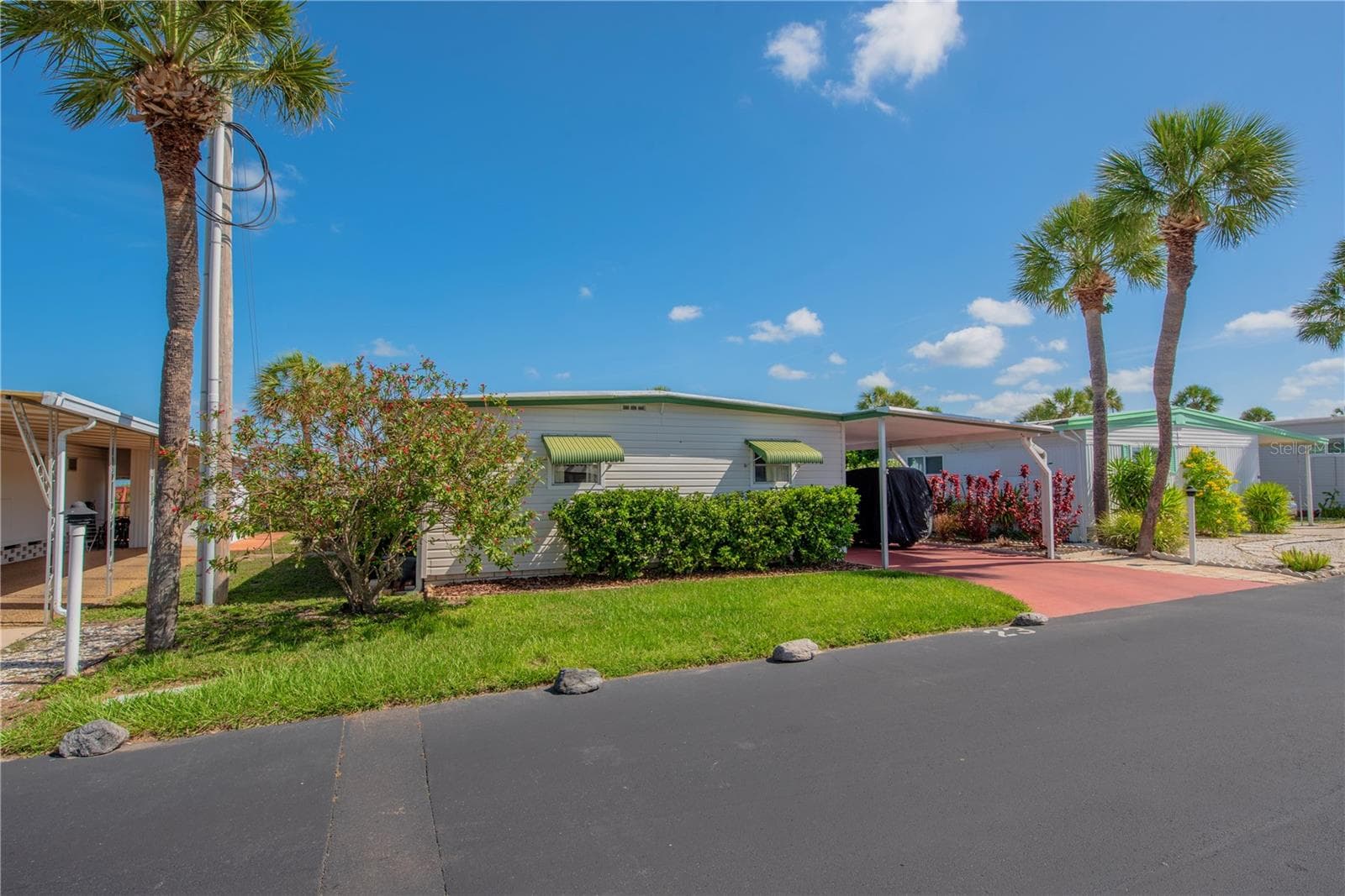 Front of home with tandem carport. - 4851 W GANDY BLVD #23C, TAMPA