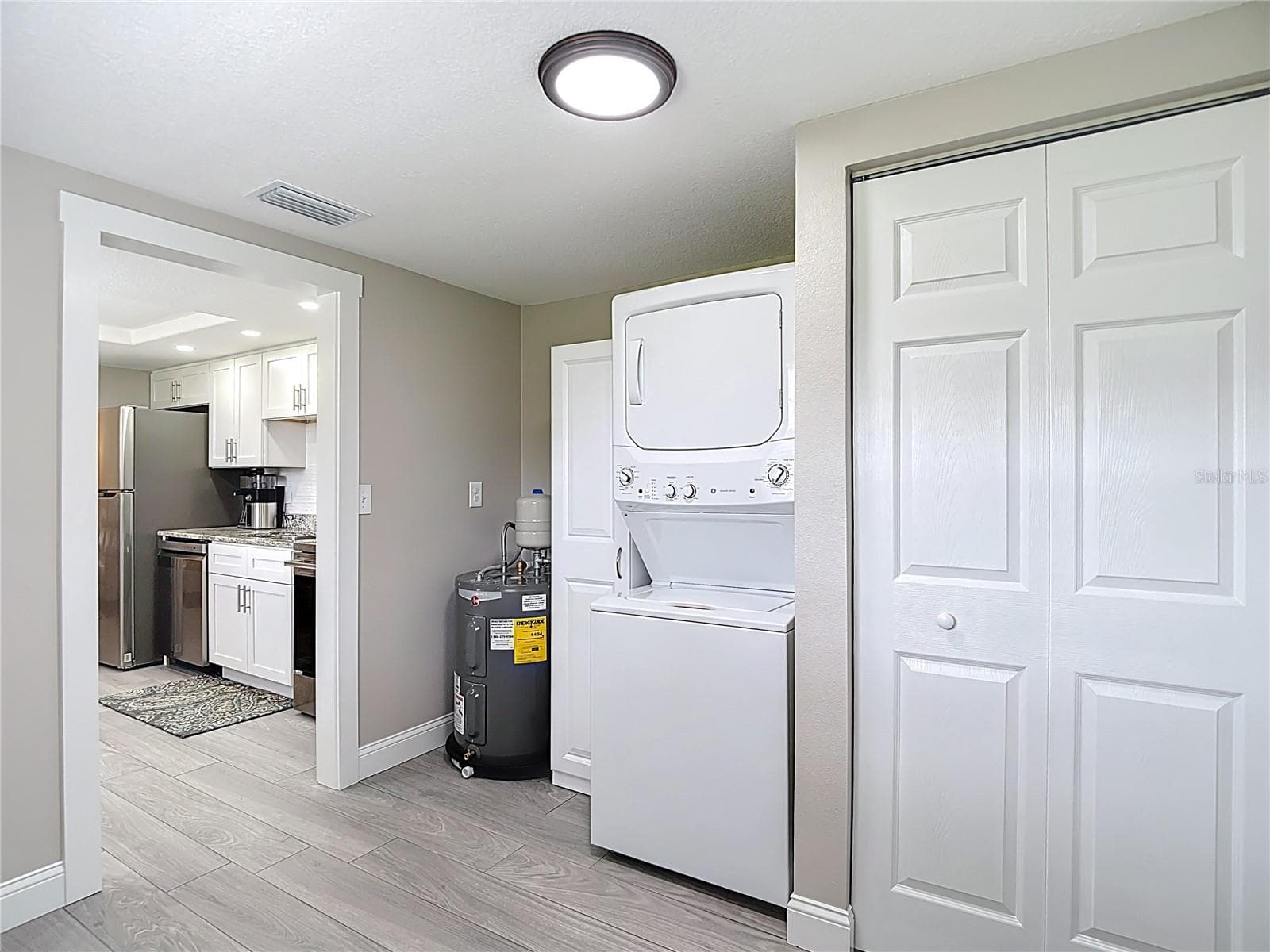 Washer and dryer located in utility room. - 14306 GUAVA STREET, HUDSON