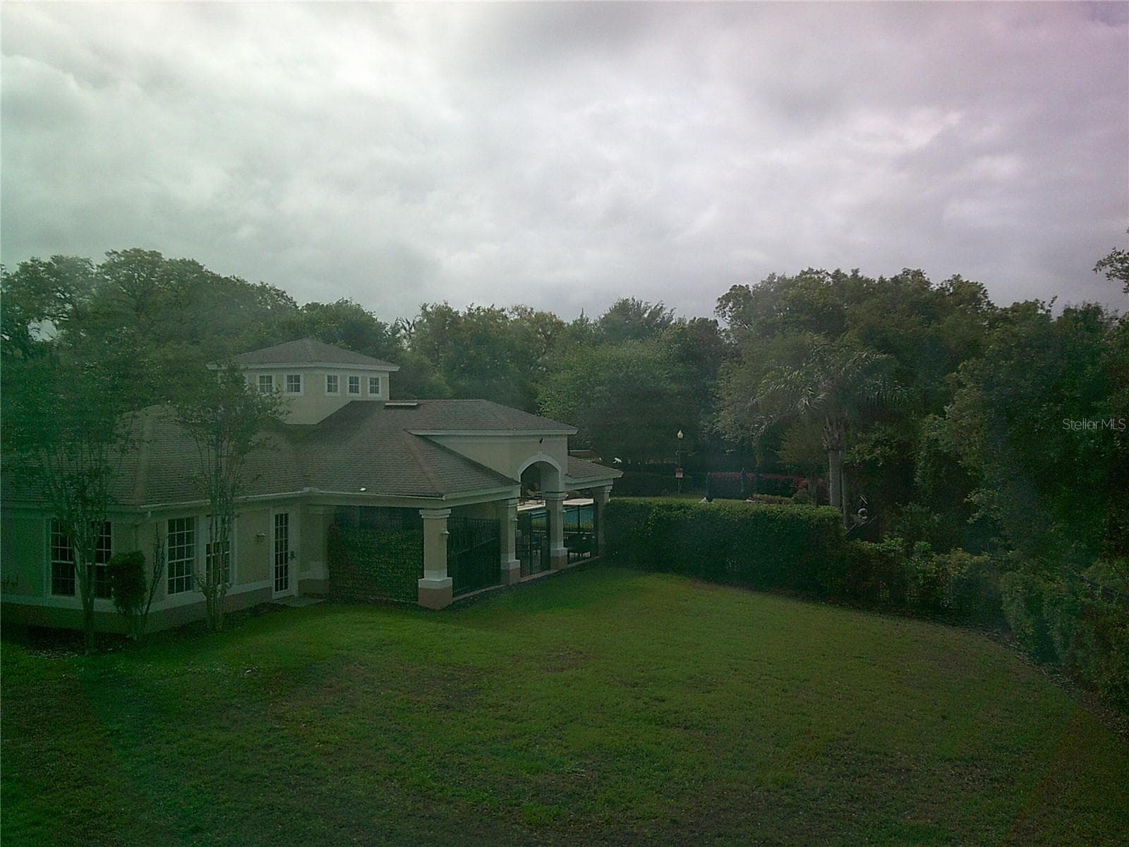 View of Clubhouse from Primary Bedroom - 6292 TWAIN ST #107, ORLANDO