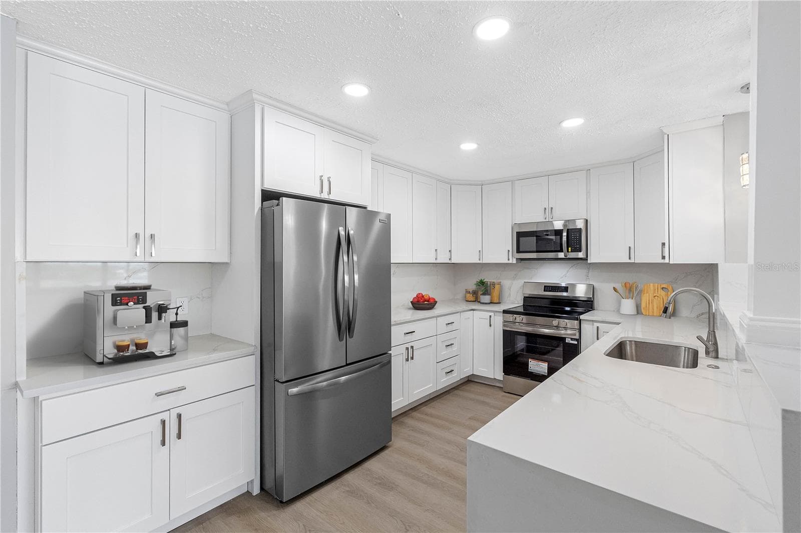 Kitchen Virtual Staged with accessories - 100 BLUFF VIEW DR #404C, BELLEAIR BLUFFS