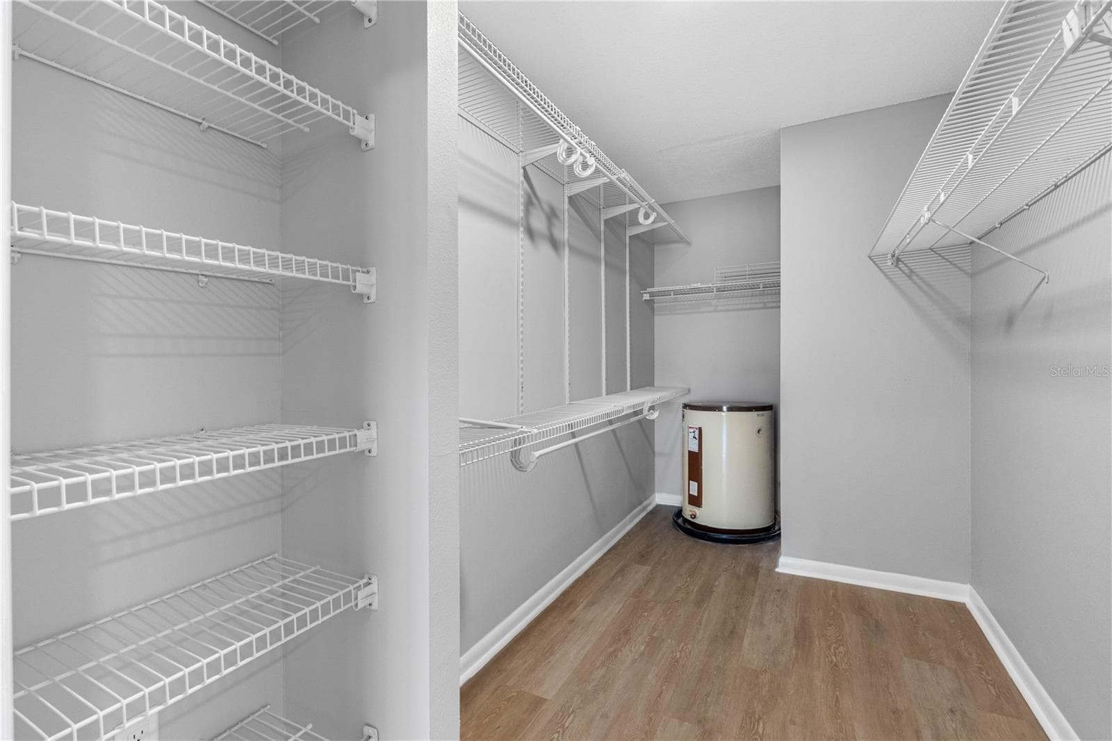 Primary Bedroom Walk-In Closet - 100 BLUFF VIEW DR #404C, BELLEAIR BLUFFS