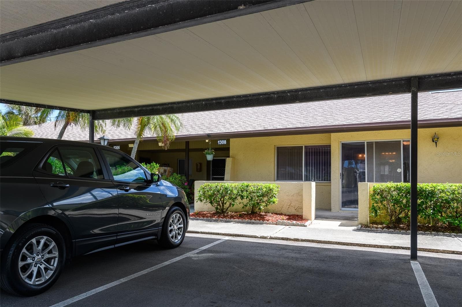 Carport outside front door. - 1308 13TH CIR SE, LARGO