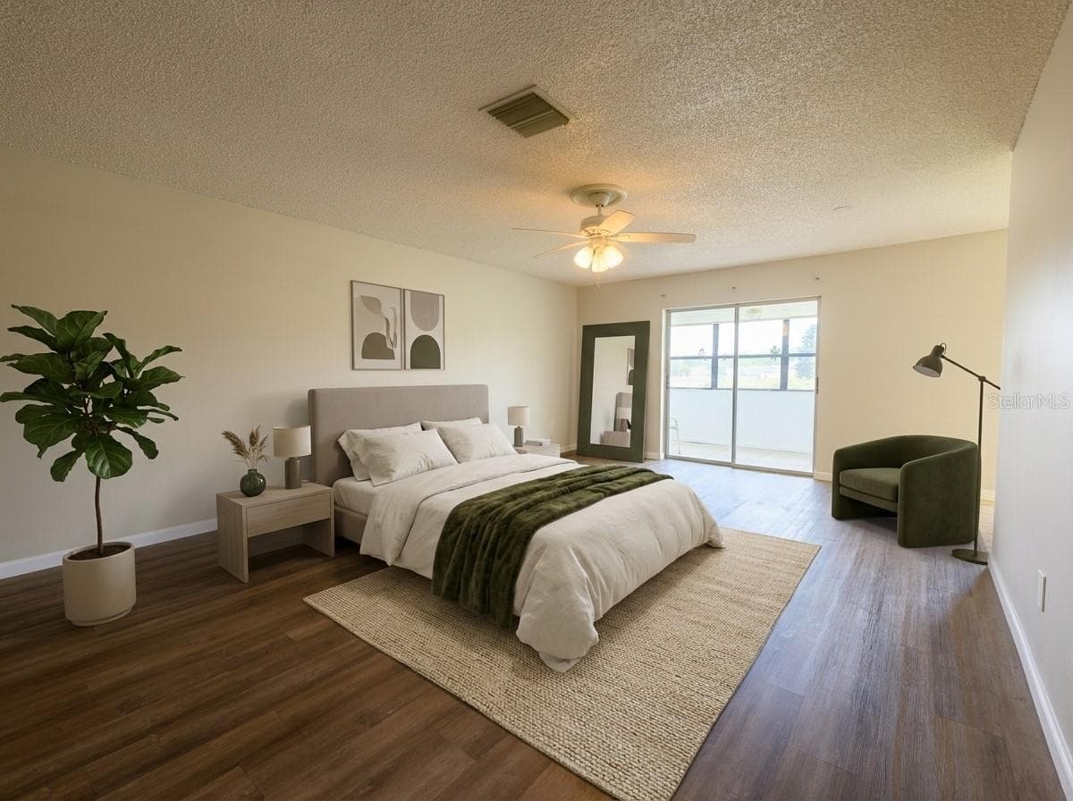 Master bedroom, sliding door to front patio. Wing has master bathroom, walk in closet. - 1308 13TH CIR SE, LARGO