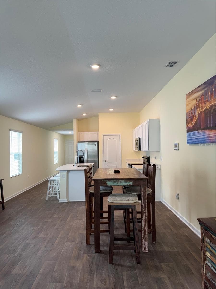 Looking from living into dining and kitchen area - 203 CHESTERWOOD RD, ST AUGUSTINE