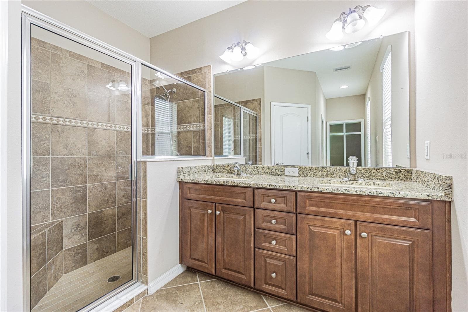 Beautiful Primary Bathroom with custom walk-in shower, dual higher vanity with granite. - 9936 GAP WEDGE DR, SAN ANTONIO