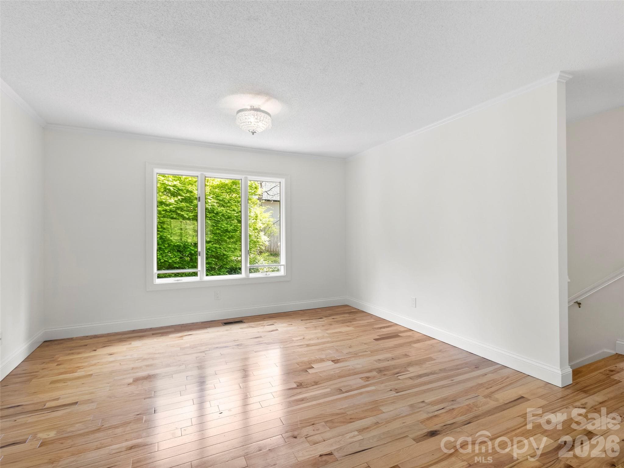 The dining room offers endless possibilities—use it for formal dining, a cozy den, home office, or whatever best fits your lifestyle. - 2731 Miller Lane, Hendersonville