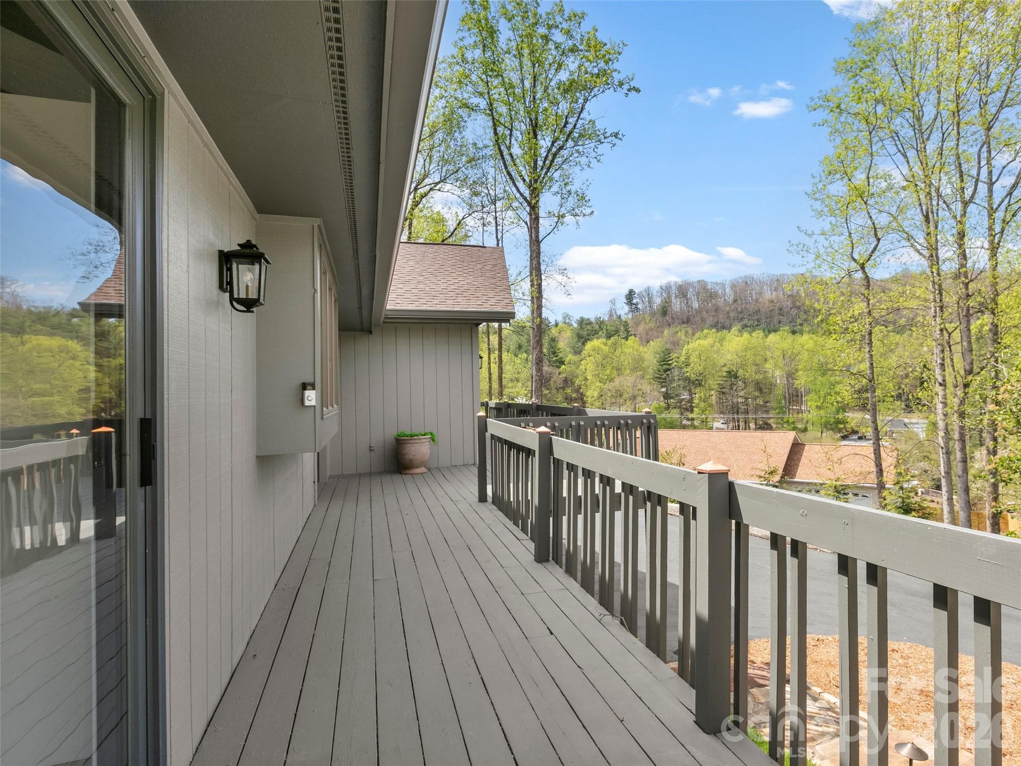 Deck leading to front door and outdoor living space. - 2731 Miller Lane, Hendersonville