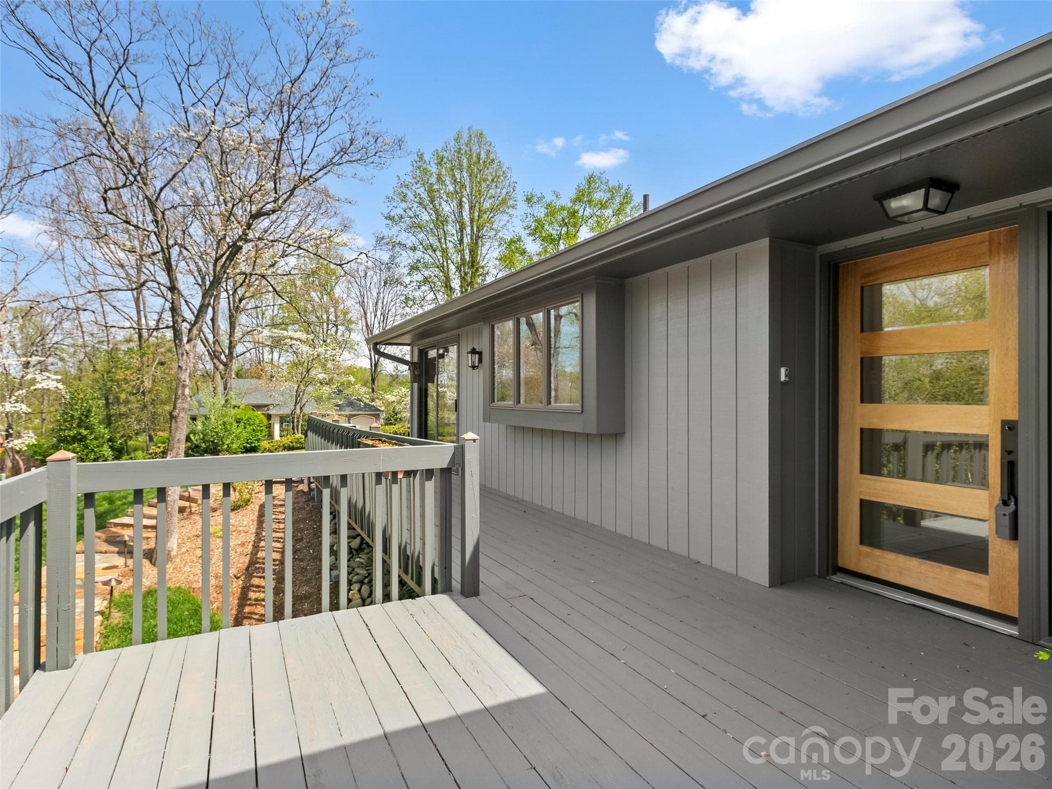 The deck provides a wonderful outdoor living space for entertaining, grilling, or taking in the fresh air. - 2731 Miller Lane, Hendersonville