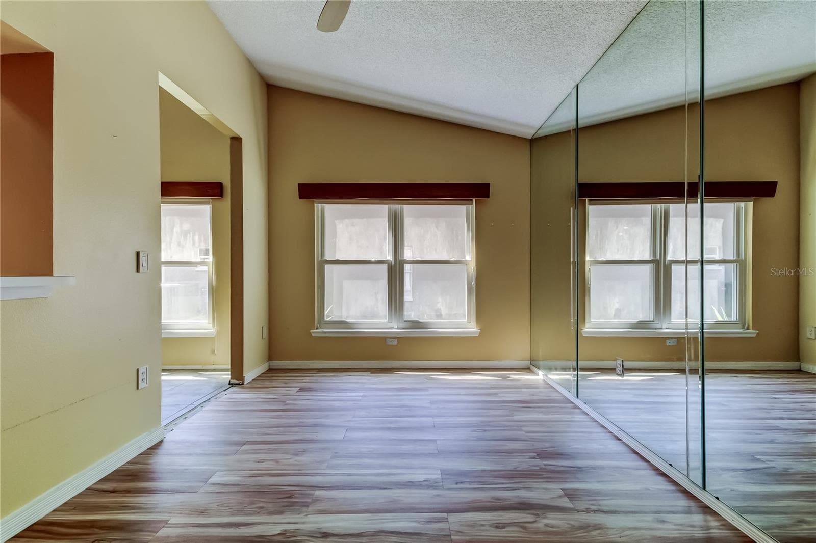 Dining Room with glass mirrors - 1795 BAYHILL DR, OLDSMAR