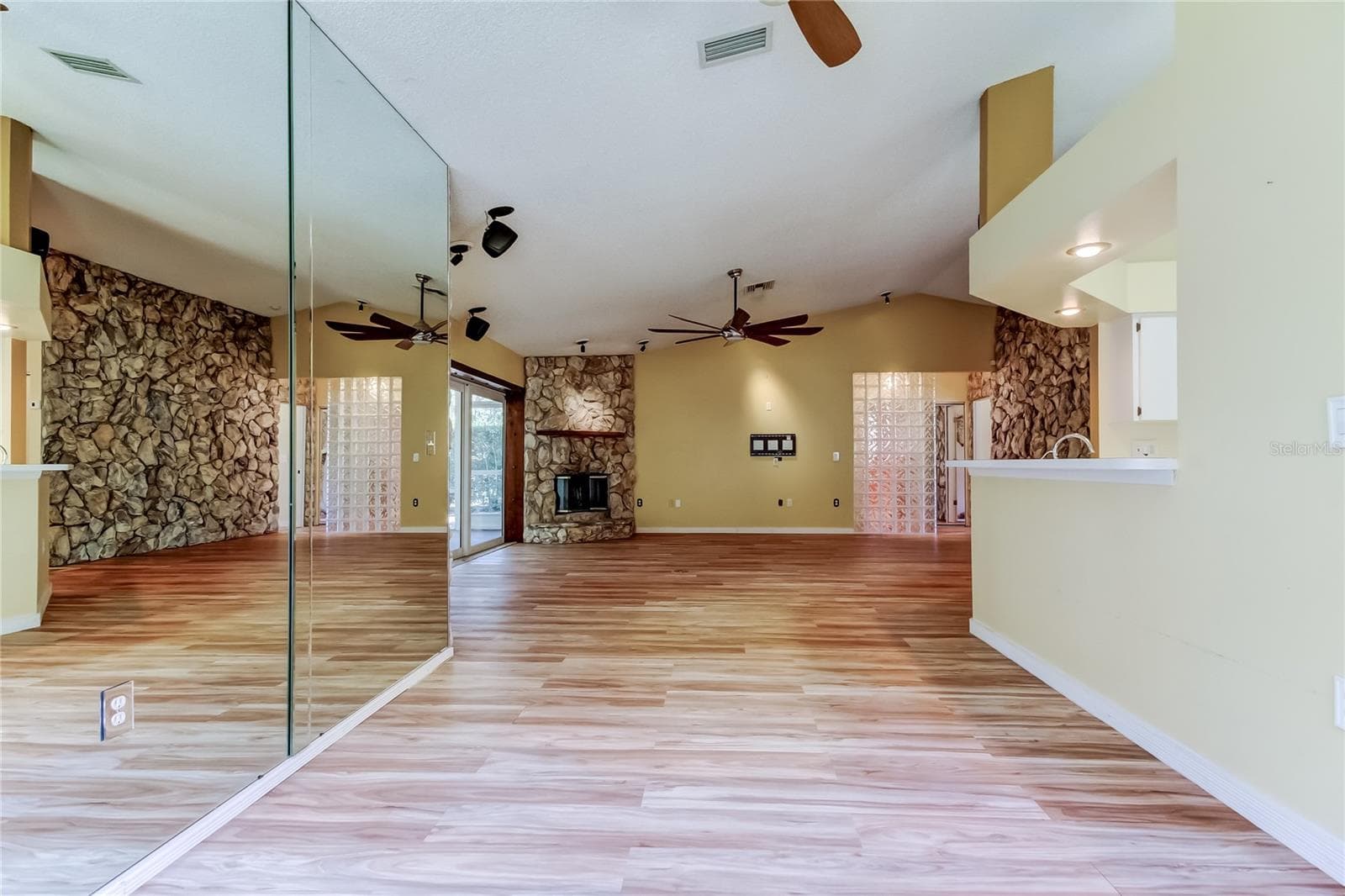 Dining Room with glass mirrors - 1795 BAYHILL DR, OLDSMAR